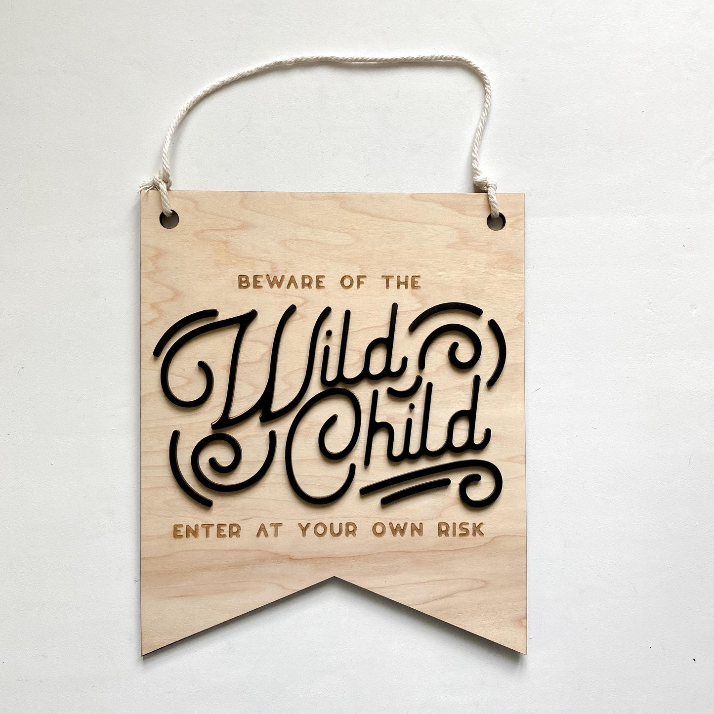 Beware of the Wild Child wall sign styled in kids bedroom or playroom