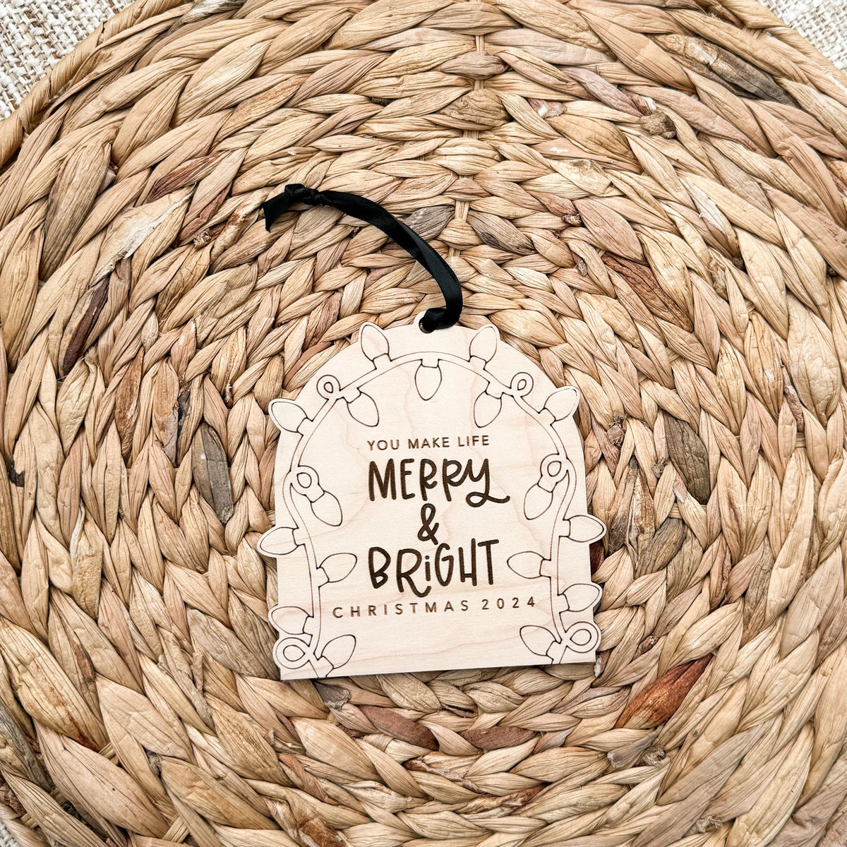 Close-up of a 1/4 inch maple wood kids Christmas ornament ready to decorate