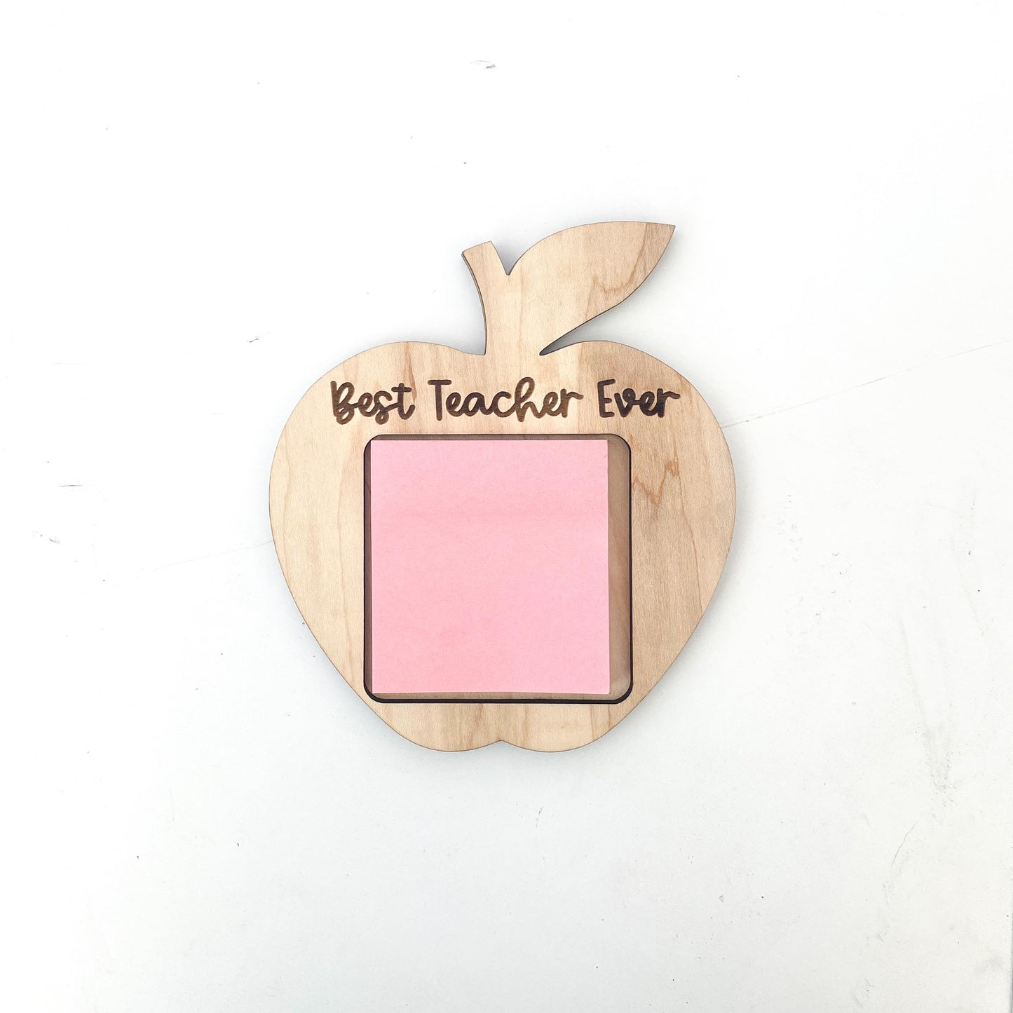 Apple-themed personalized sticky note holder showing engraved teacher name