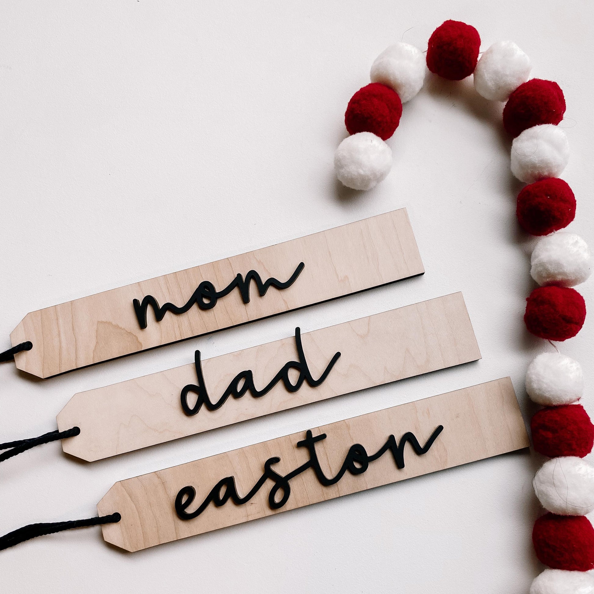 Set of boho maple wood stocking name tags with engraved names for Christmas