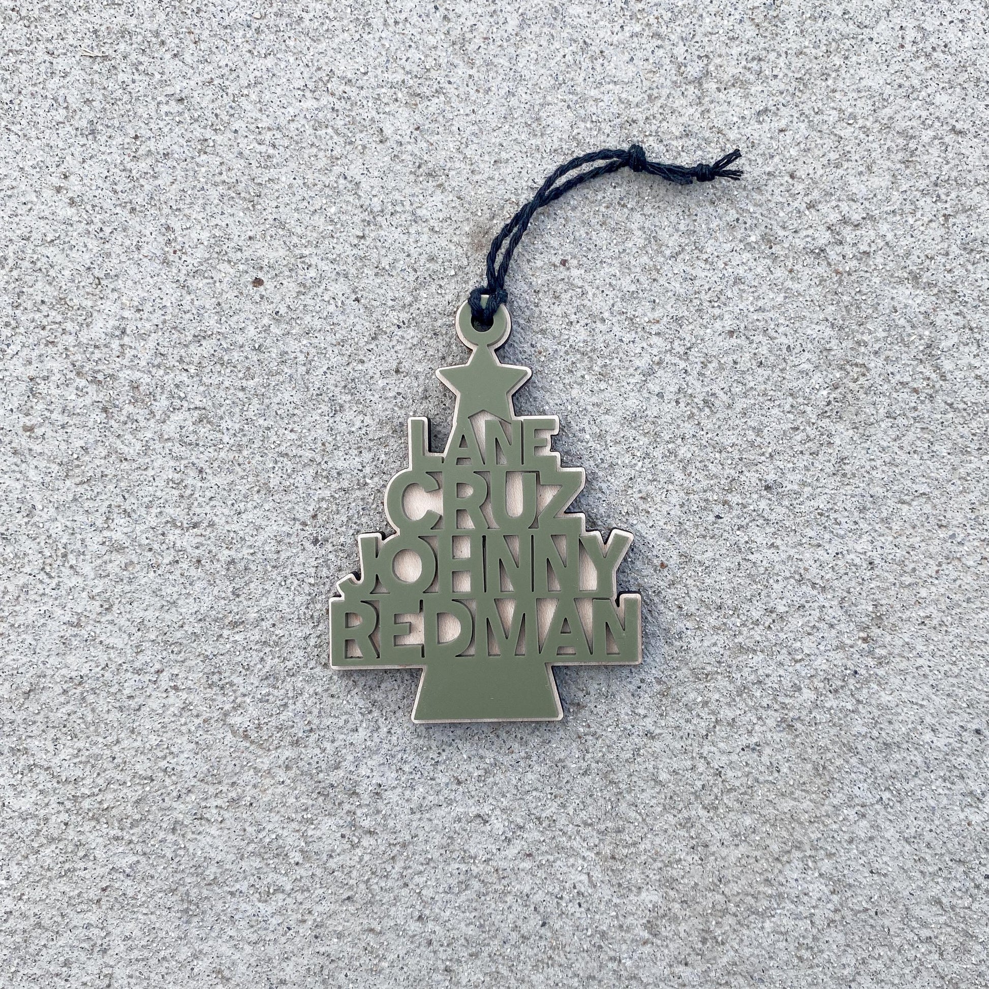 Personalized maple wood Christmas ornament with engraved name, holiday keepsake