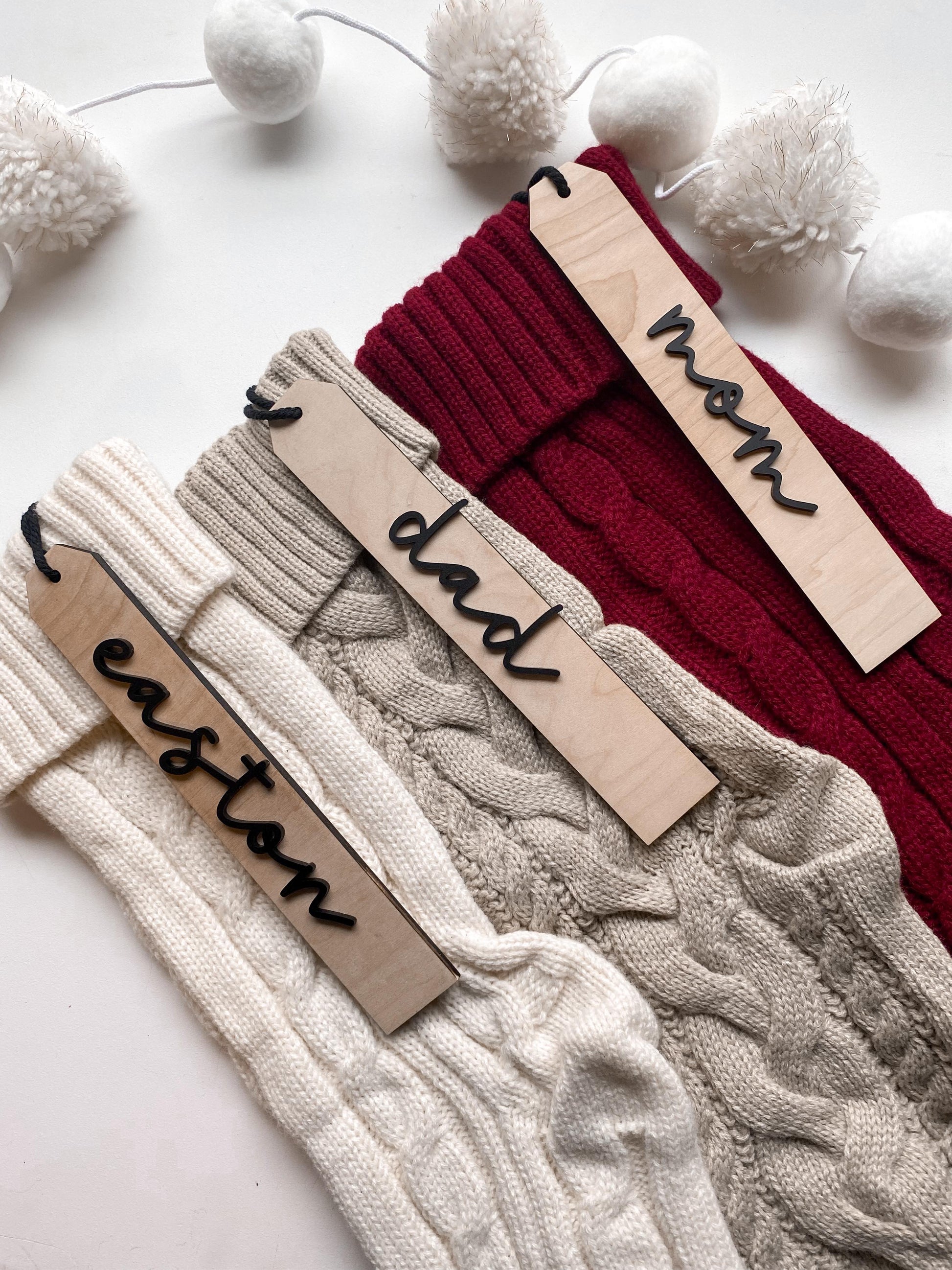 Personalized boho wood Christmas stocking tags with custom names, holiday mantel decor