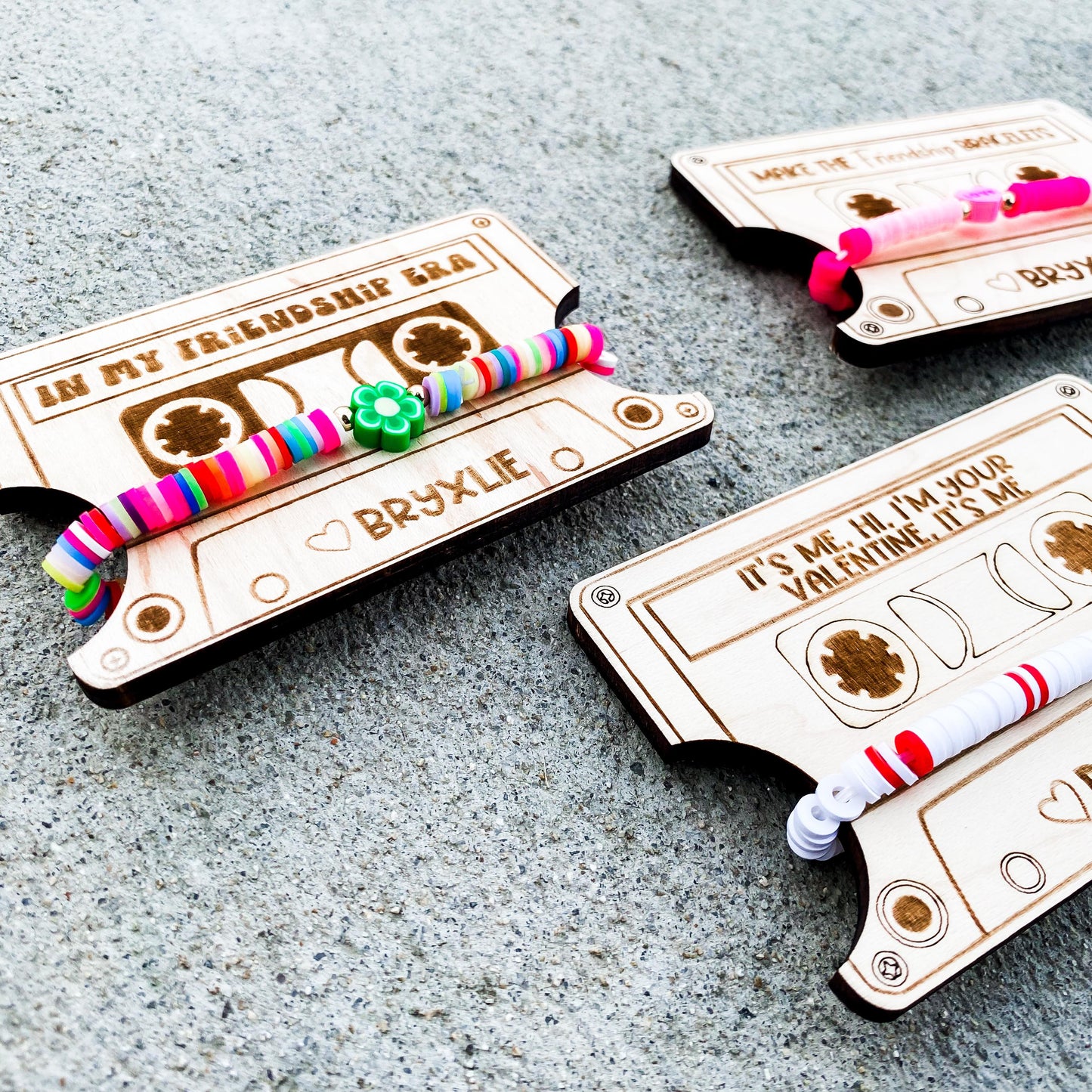 Close-up of Valentine Era friendship bracelet card and wearable bracelet