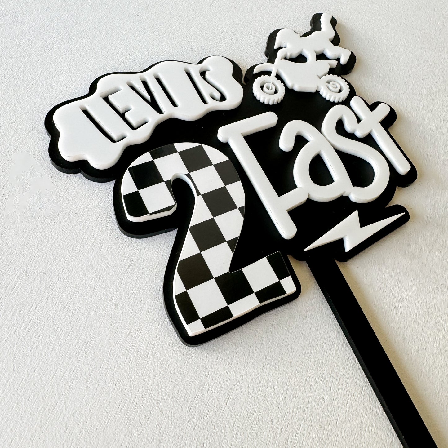 Personalized Two Fast dirt bike birthday cake topper with child's name and checkered design