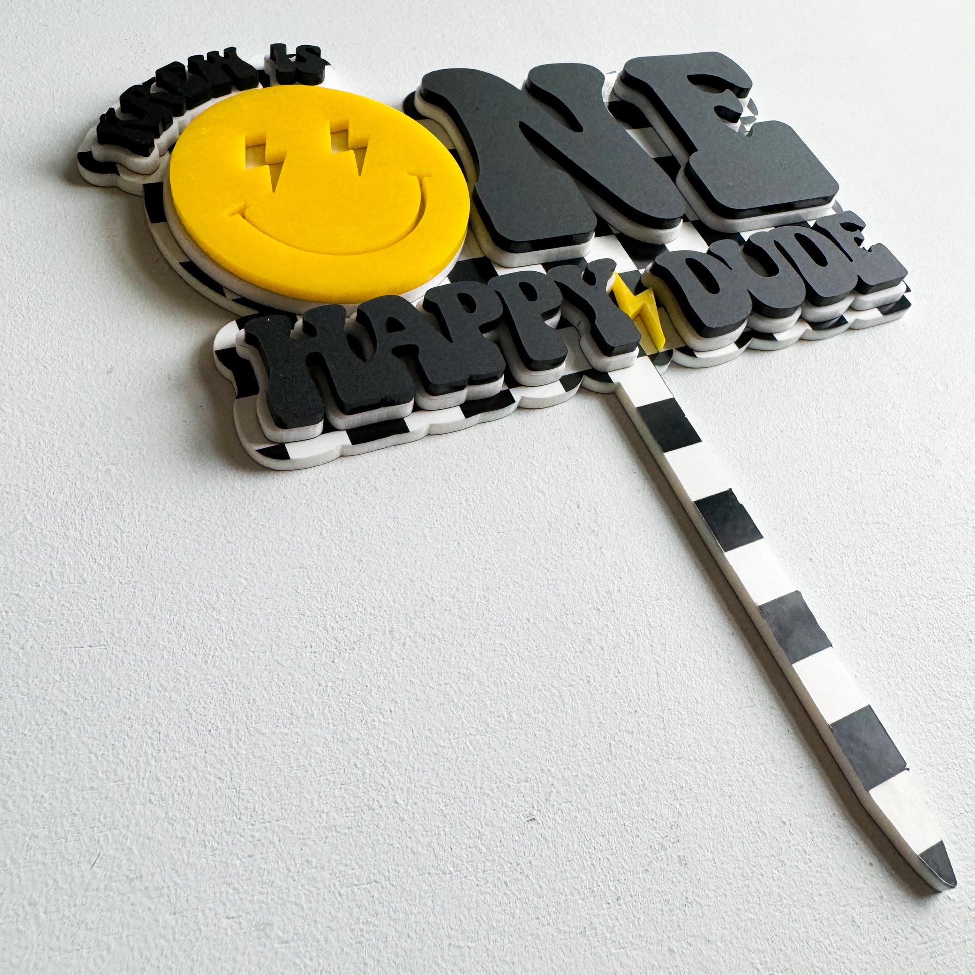 Personalized One Happy Dude cake topper showing acrylic construction and custom name