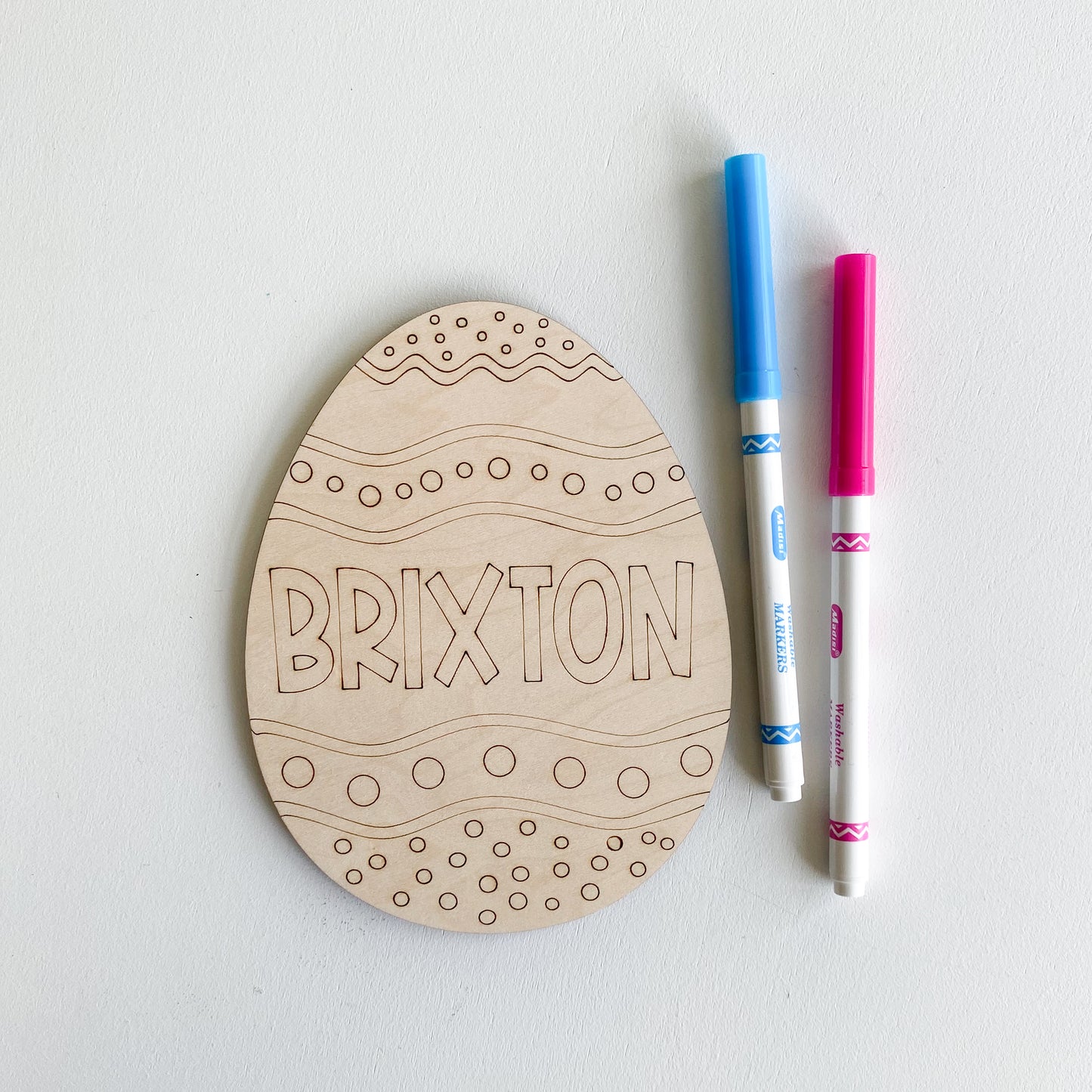 Color your own Easter egg showing blank wooden egg shape ready to decorate