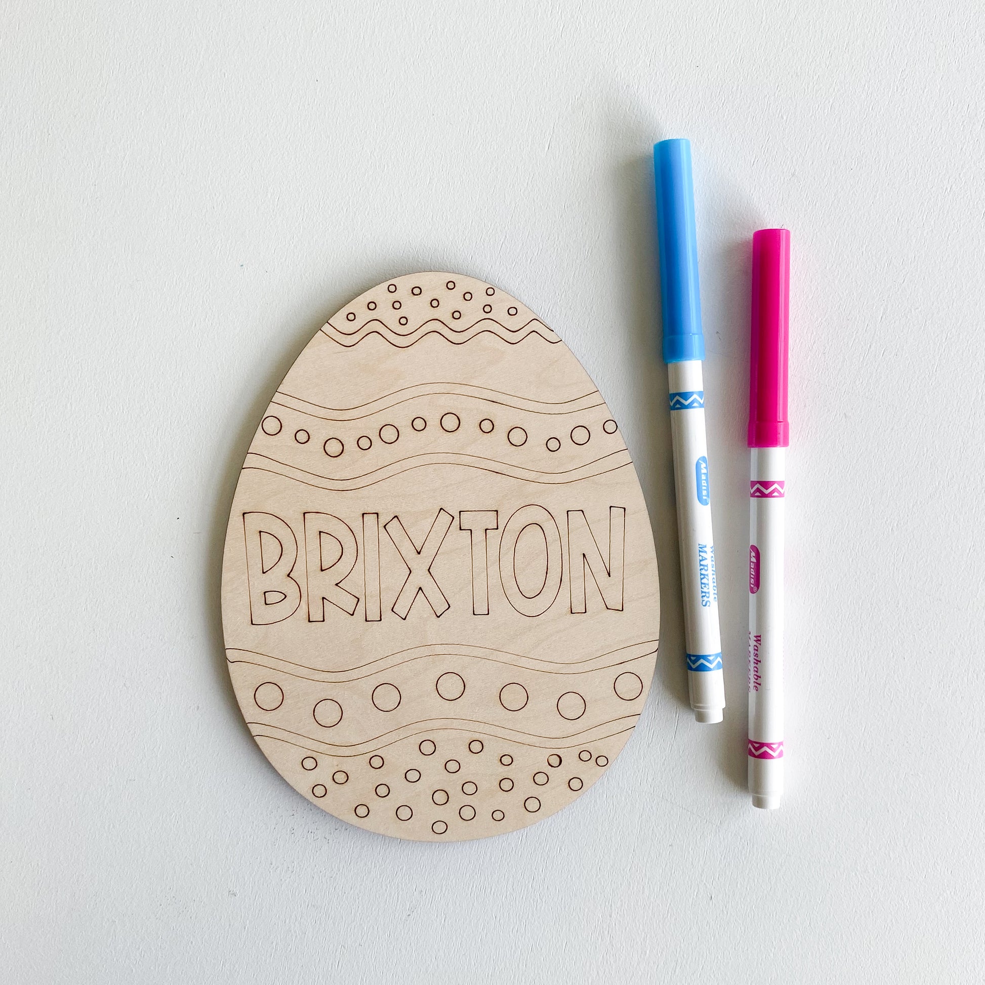 Color your own Easter egg showing blank wooden egg shape ready to decorate