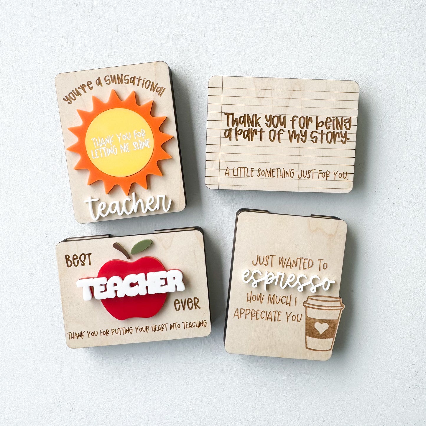 Teacher gift card holder showing multiple sentiment designs in wood and acrylic