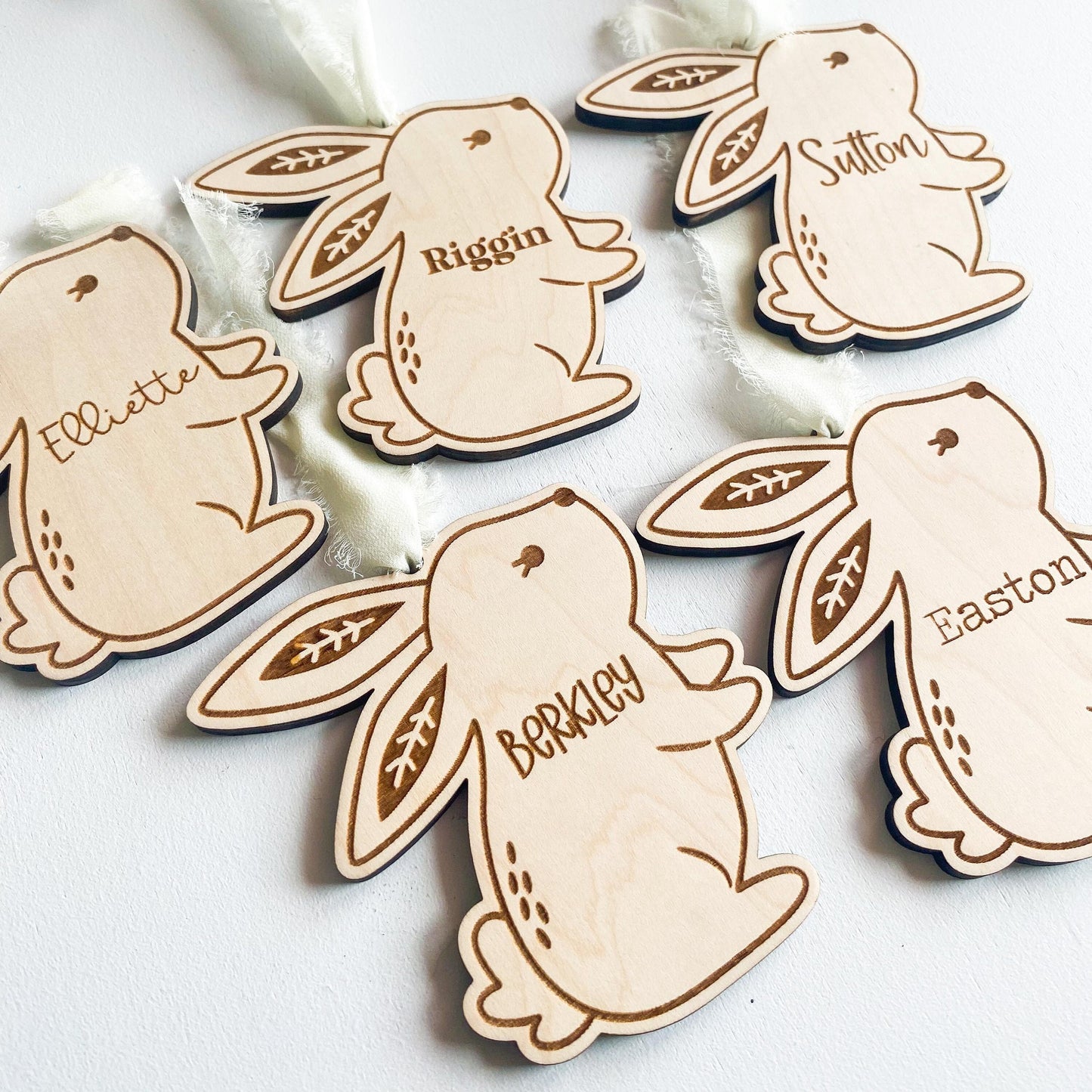 Close-up of boho bunny Easter basket tag in maple wood with personalized name