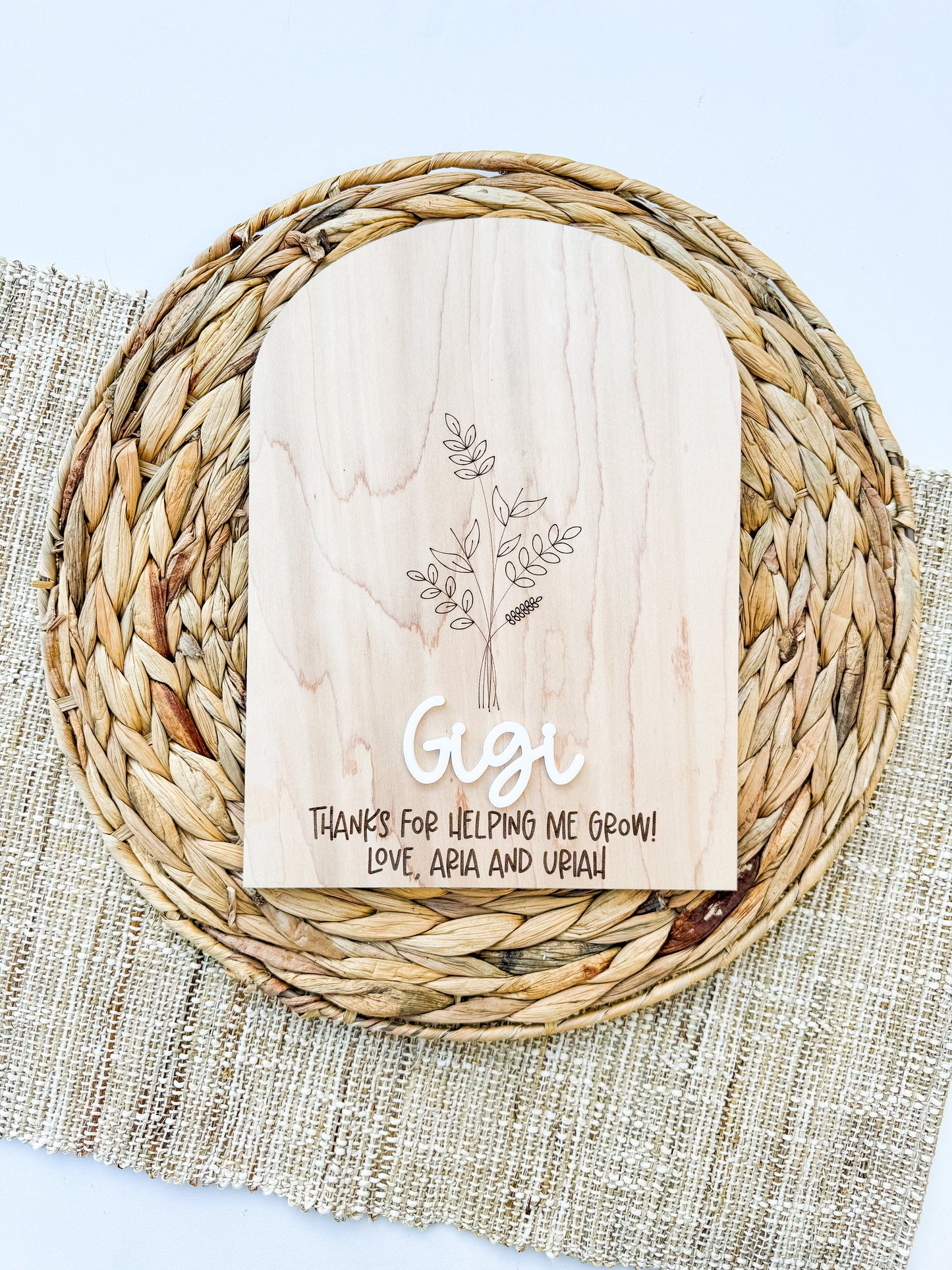 Custom Grandma handprint keepsake sign with children’s painted handprints on maple wood. Laser engraved floral design and raised acrylic name with “Thanks for helping me grow” message, thoughtful gift for Nana, Gigi, or Grandma.