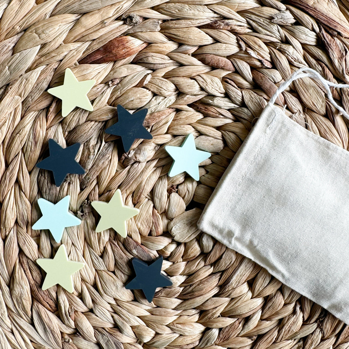 Acrylic star reward tokens in mixed colors for a chore chart jar