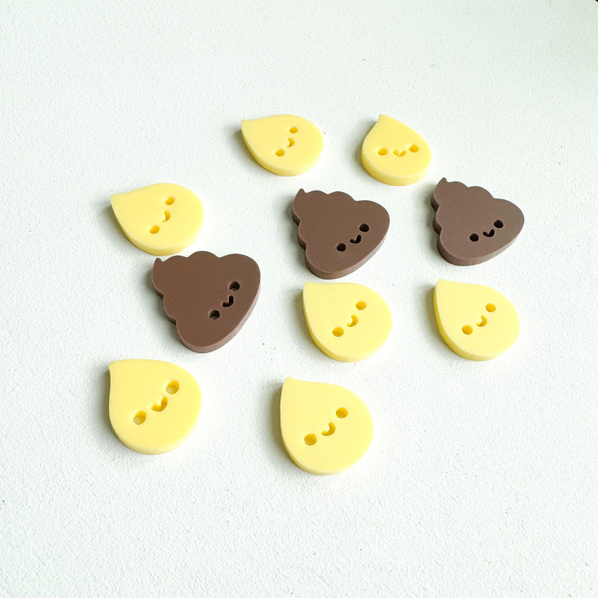 Close-up of acrylic potty incentive tokens for a reward jar