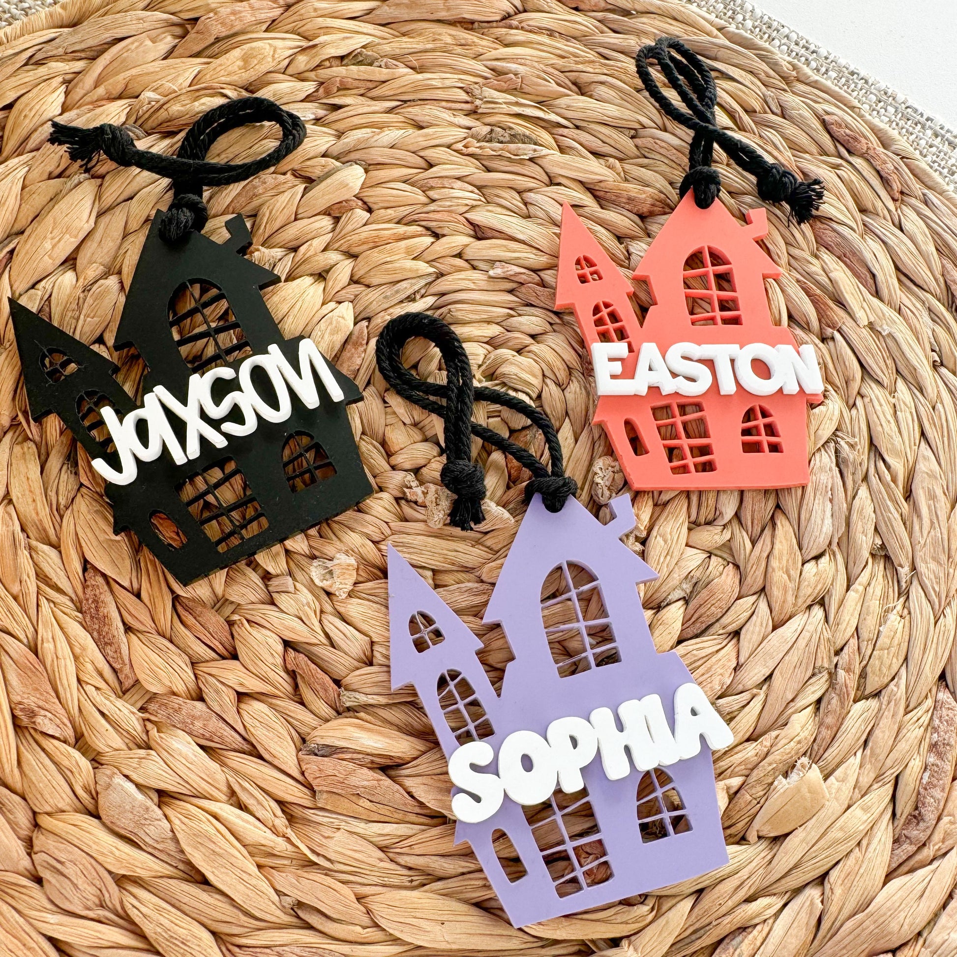 Close-up of personalized acrylic Halloween boo basket name tag with engraved child's name