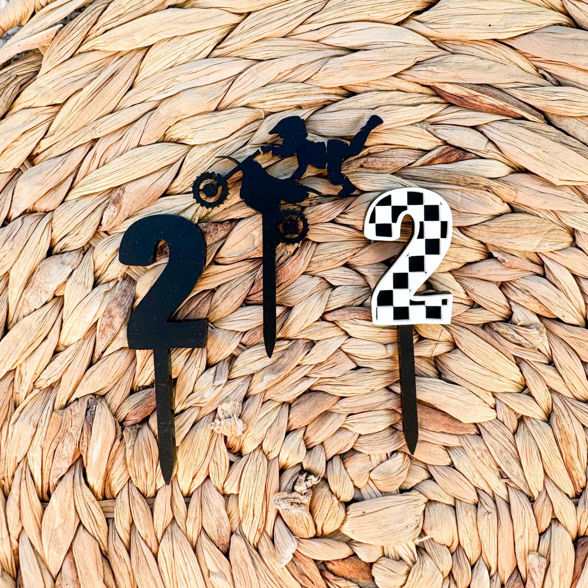 Personalized dirt bike checkered cupcake toppers showing acrylic construction