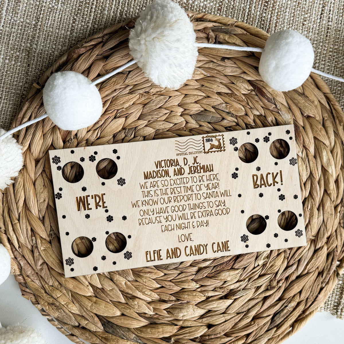 Two elf We're Back arrival postcard in engraved maple wood with cutouts on both ends