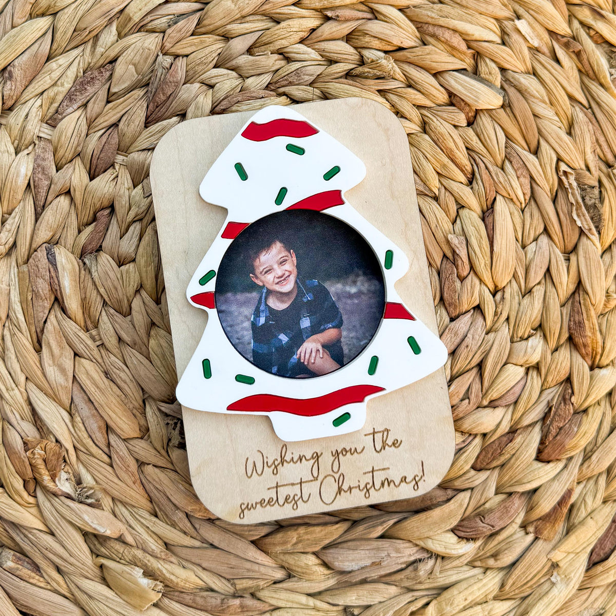 Close-up of the engraved custom message on a Christmas photo frame magnet