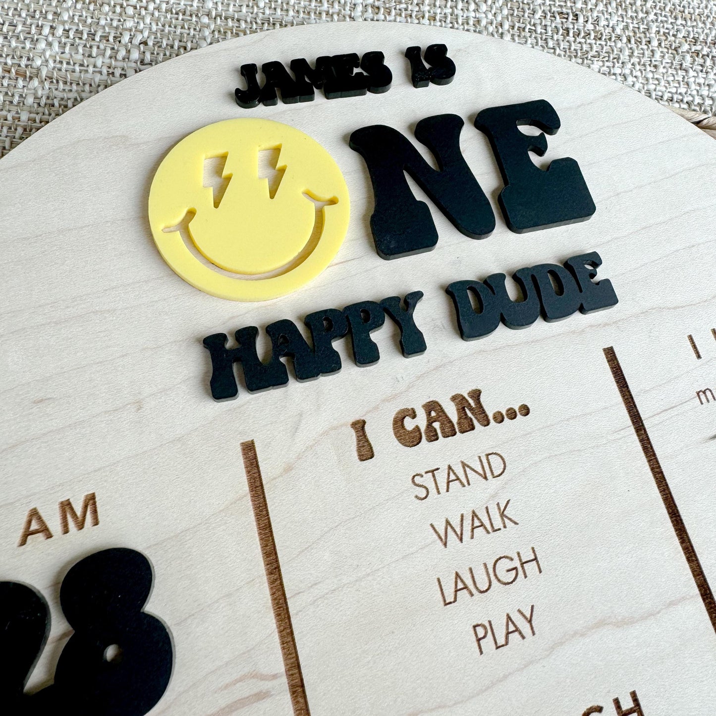 Close-up of One Happy Dude first birthday stat board with personalized baby information