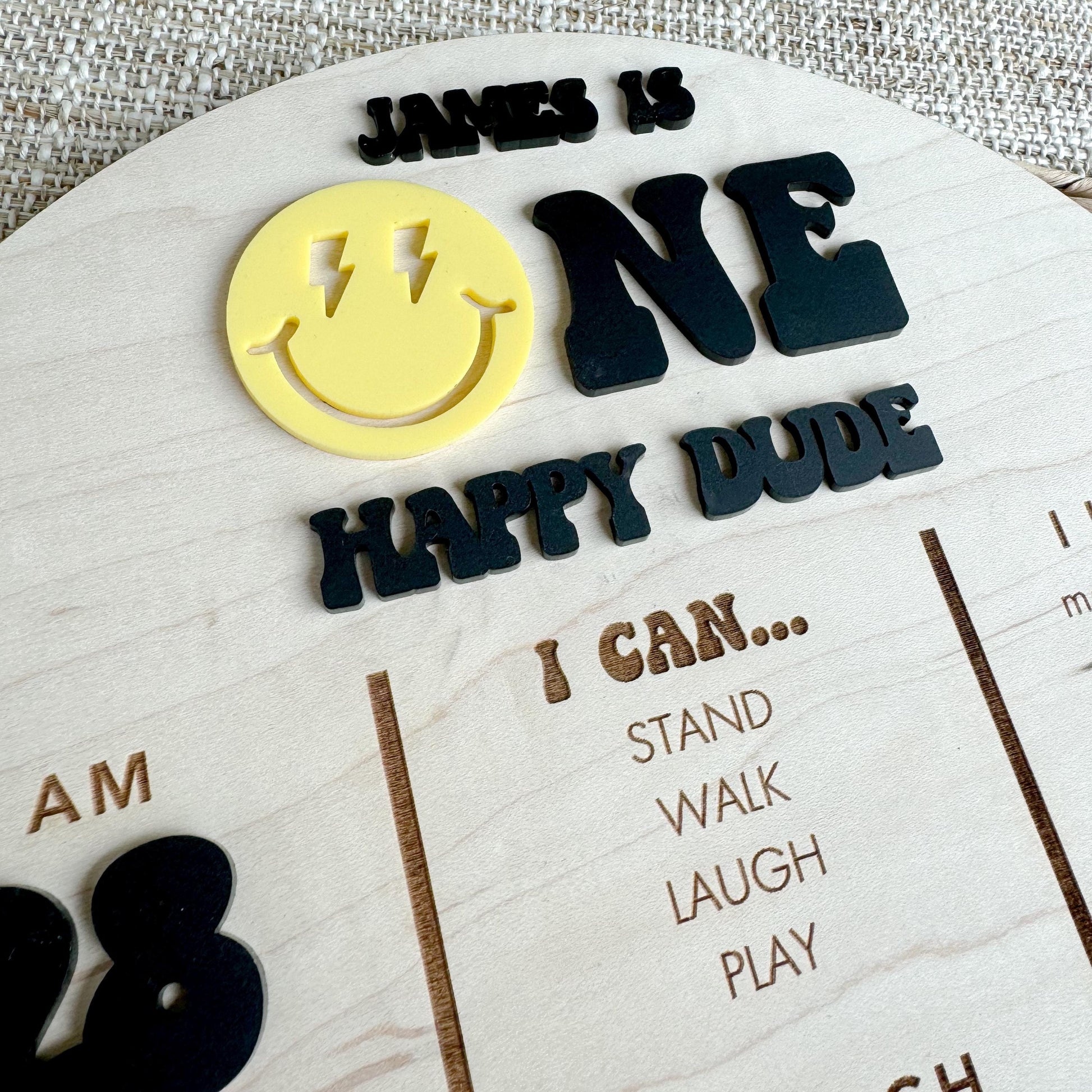 Close-up of One Happy Dude first birthday stat board with personalized baby information