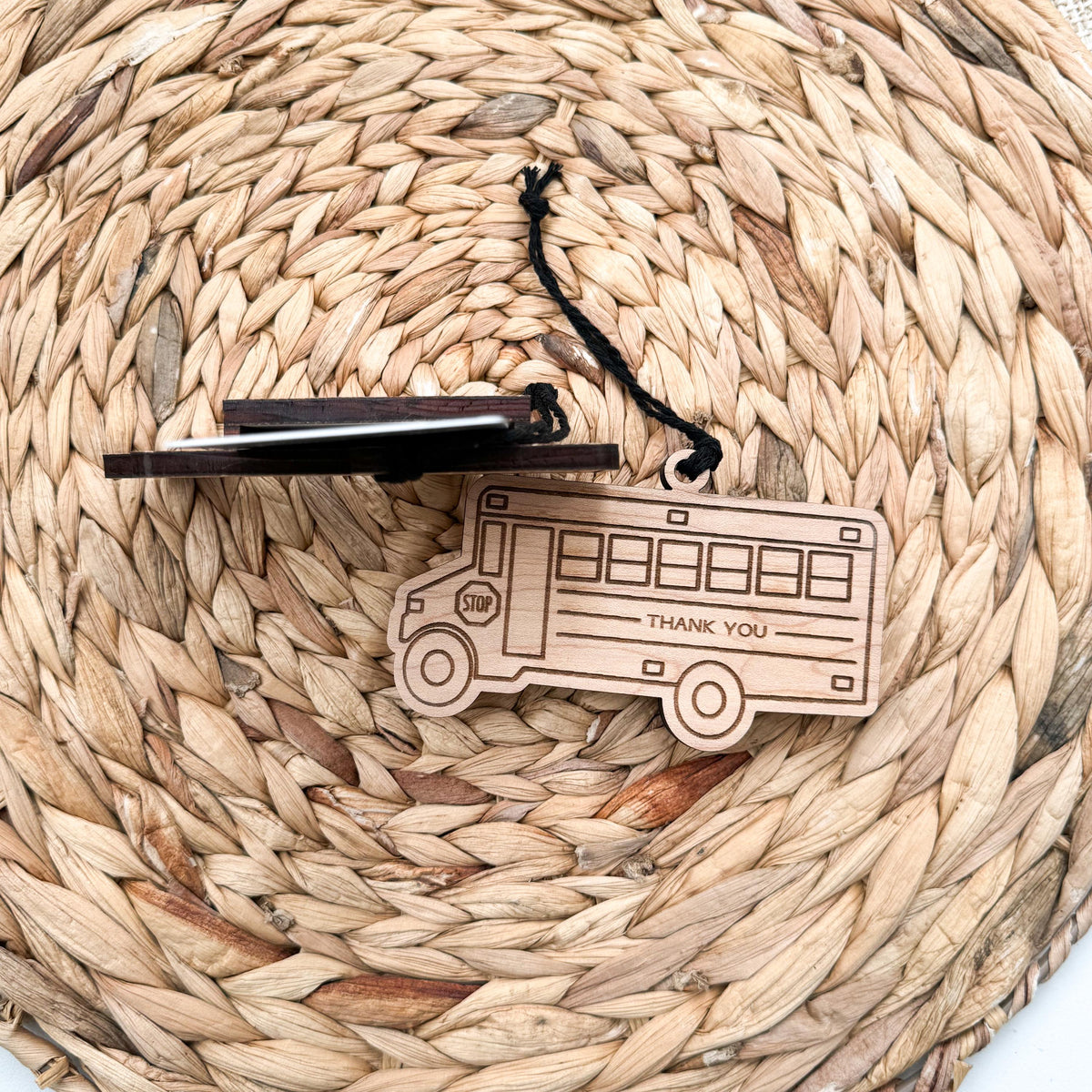 Close-up of the laser cut maple wood driver ornament that holds a gift card