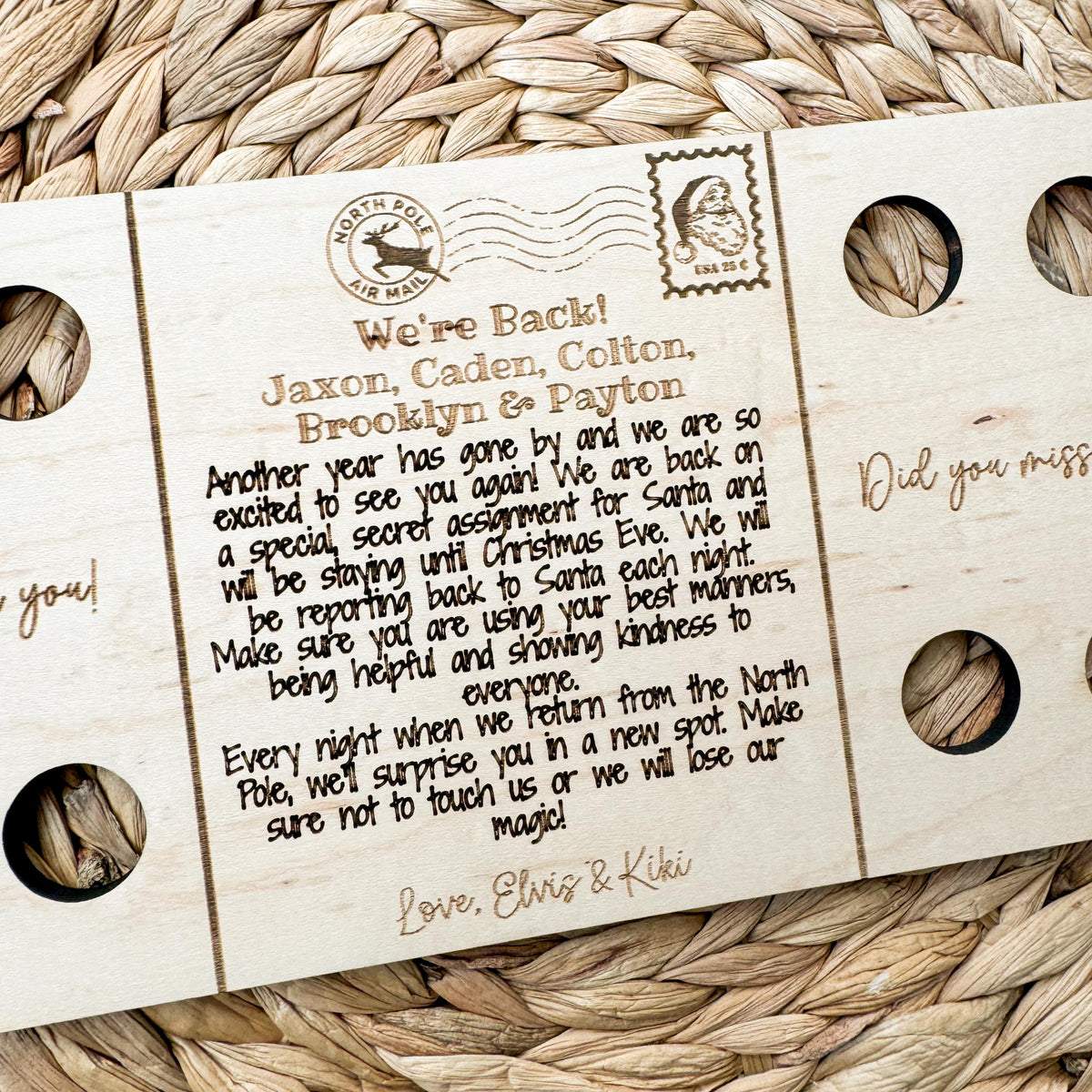 Close-up of the two elf postcard engraving with personalized children names and a Christmas postmark design