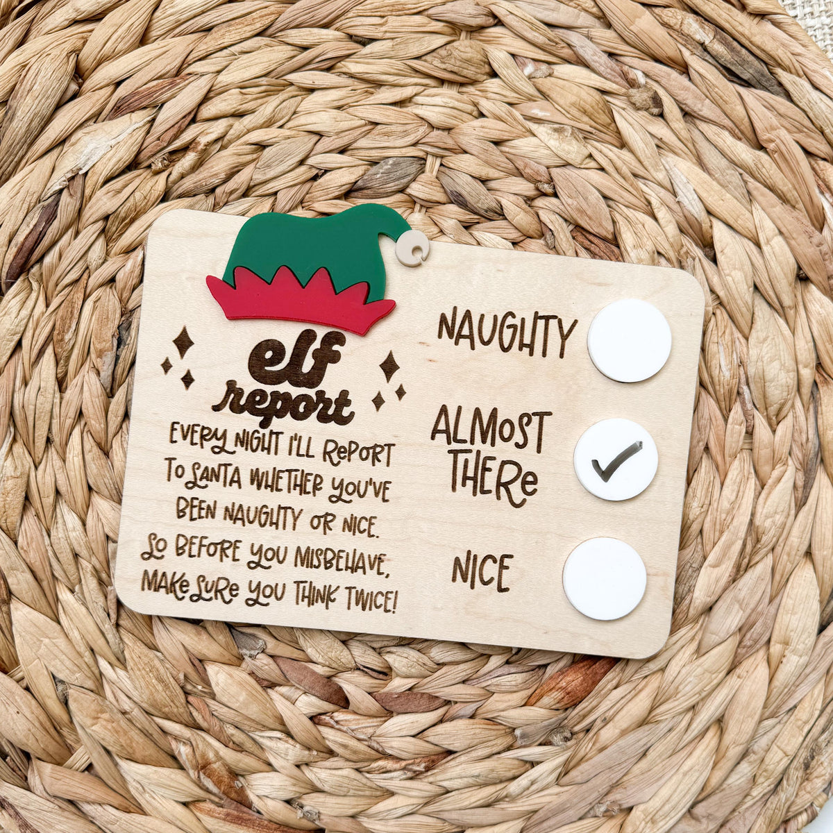 Elf report card dry erase board in maple wood with acrylic elf hat and naughty, almost there and nice check circles