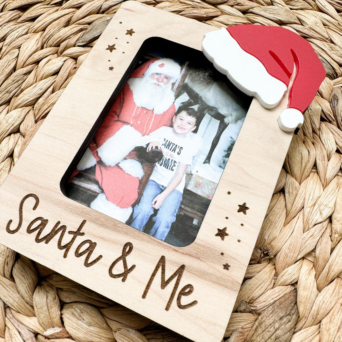 Wood and acrylic Santa picture frame holding a holiday photo