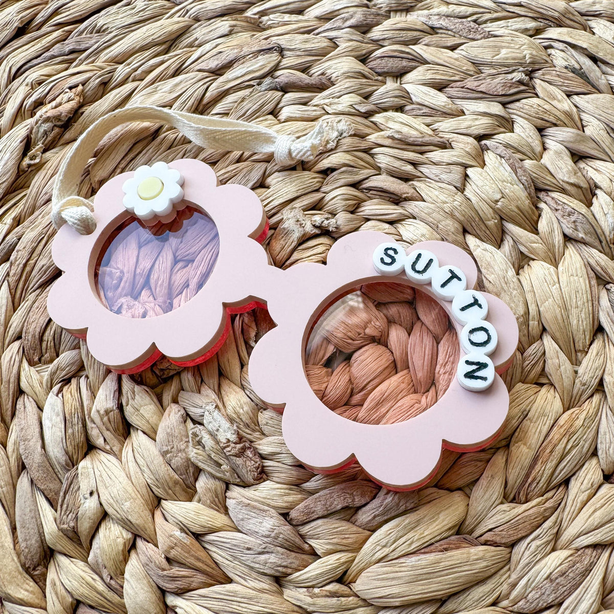 Close-up of the layered acrylic flower sunglasses name tag