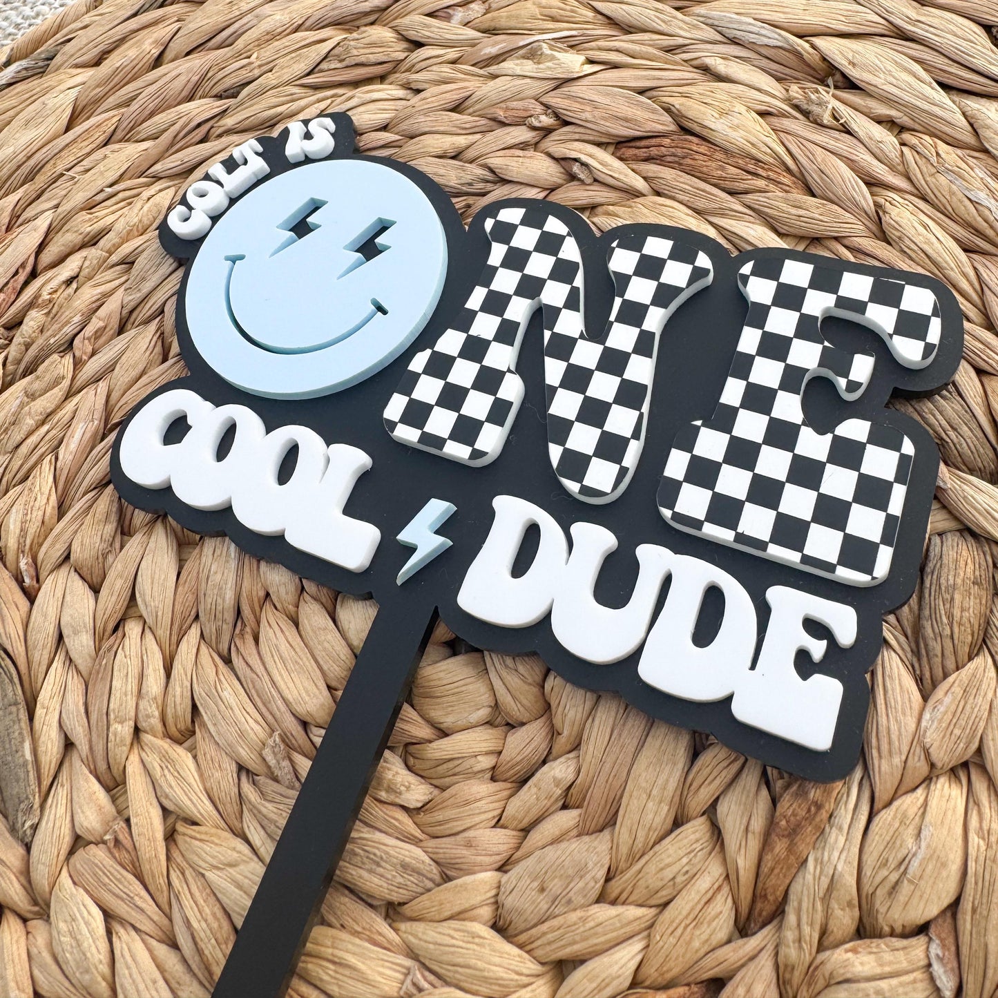Personalized One Cool Dude 1st birthday topper showing checker design and custom name