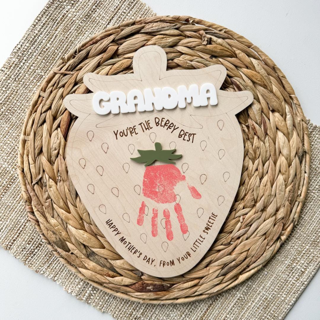 Strawberry handprint sign in maple wood with an acrylic name and bow