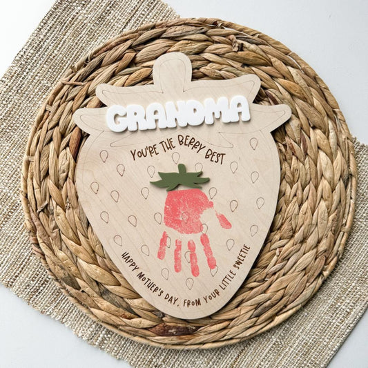 Strawberry handprint sign in maple wood with an acrylic name and bow