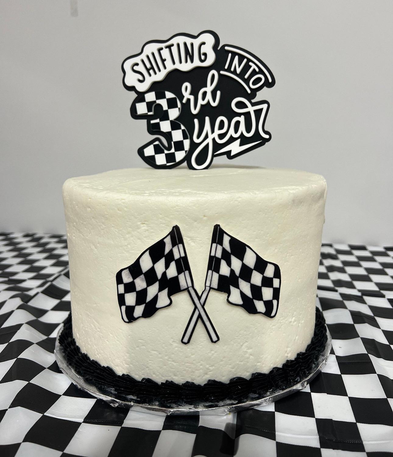 Personalized Shifting into Gear motocross birthday topper showing acrylic construction