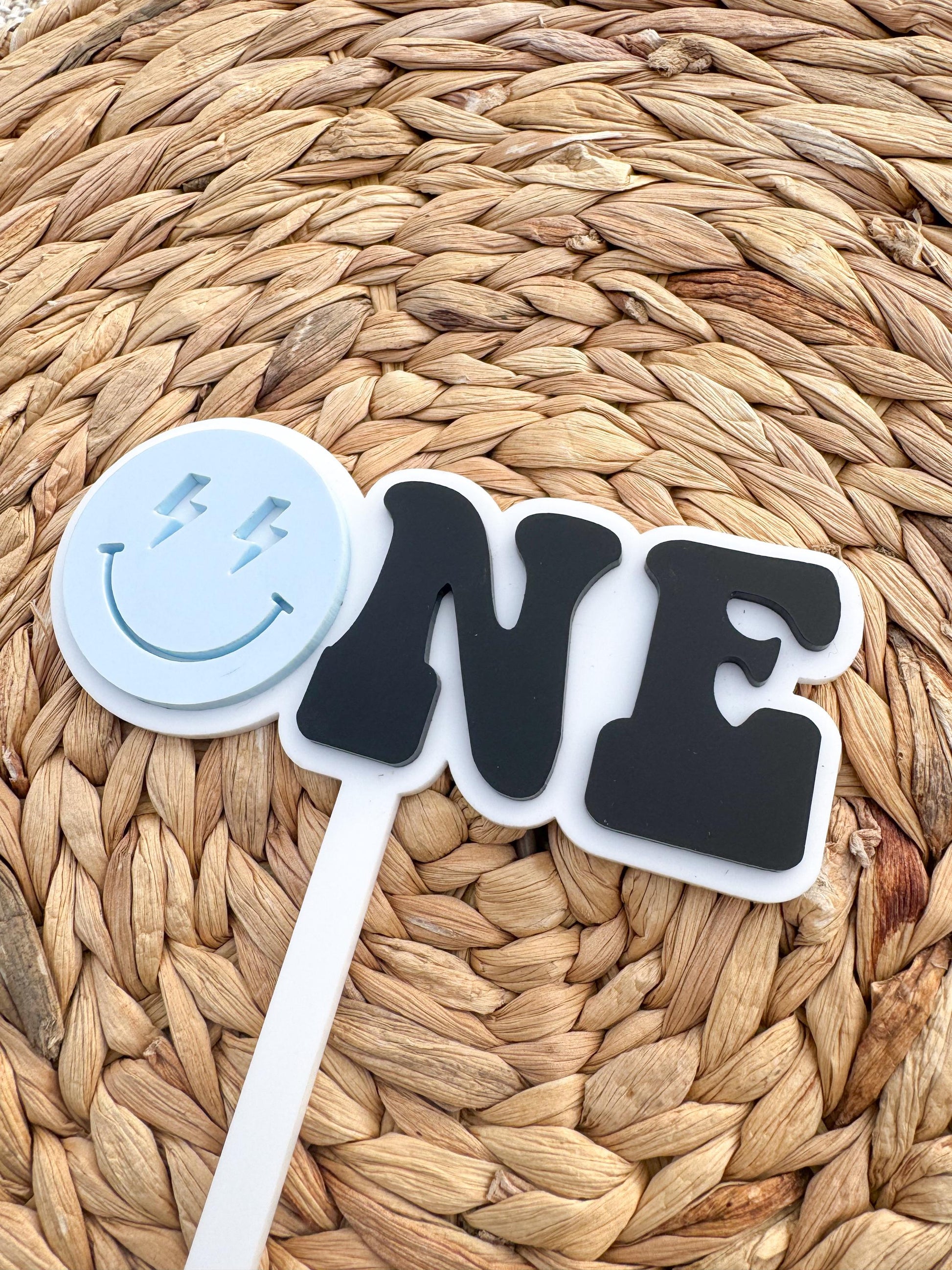 Personalized minimalist smiley face ONE topper showing modern acrylic design