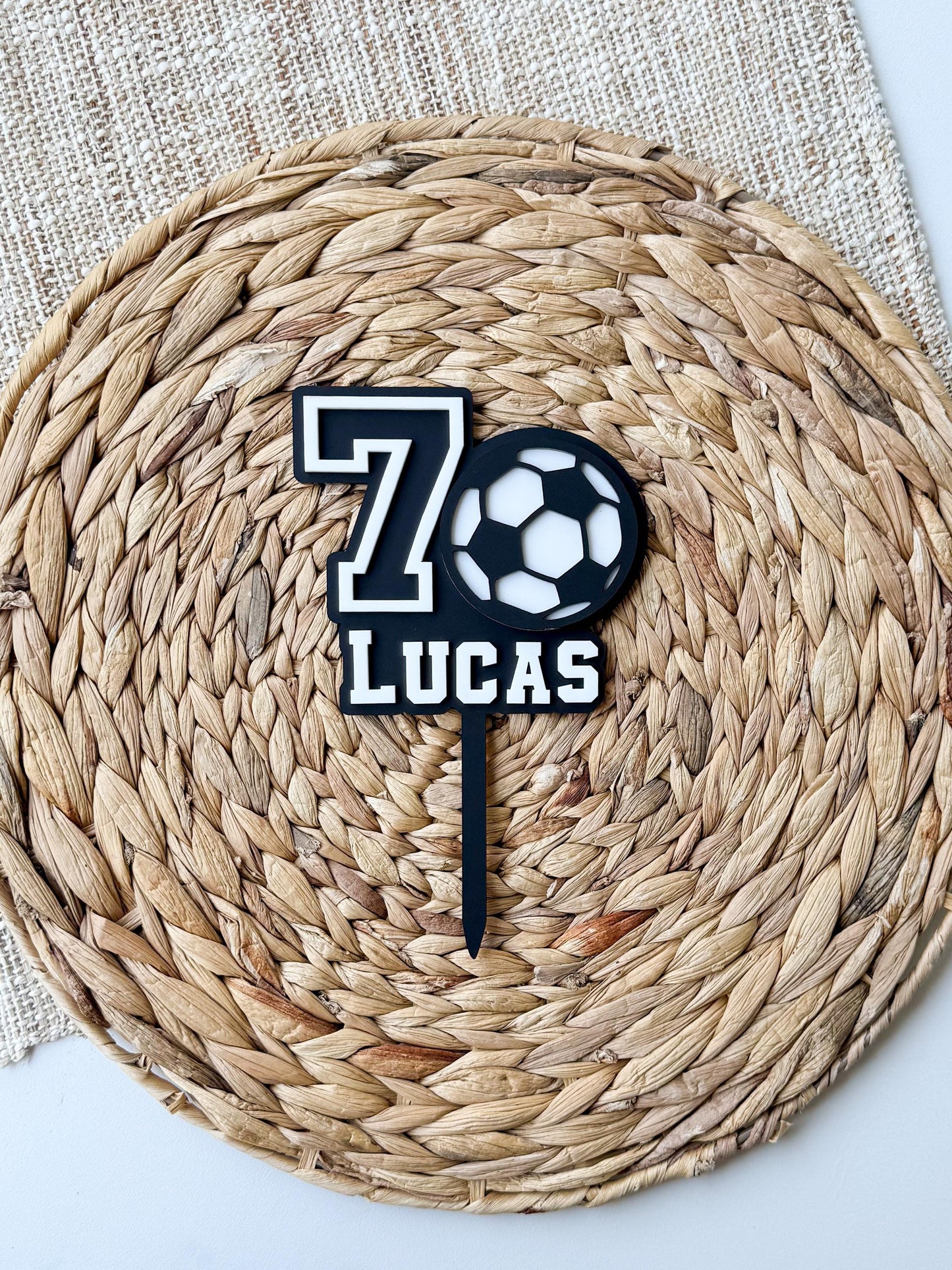 Personalized soccer cake topper showing custom name and sports design in acrylic