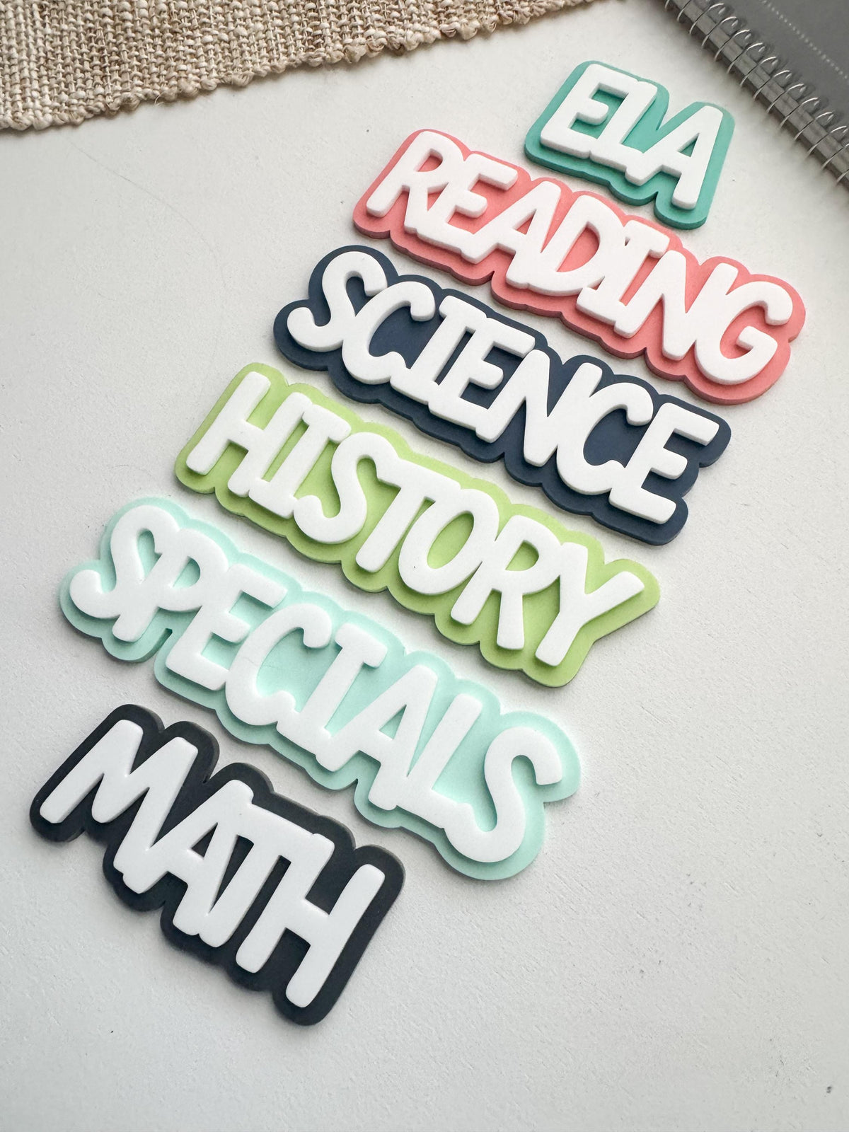 Full set of layered acrylic subject magnets - ELA, Reading, Science, History, Specials, and Math labels in pastel colors with white lettering