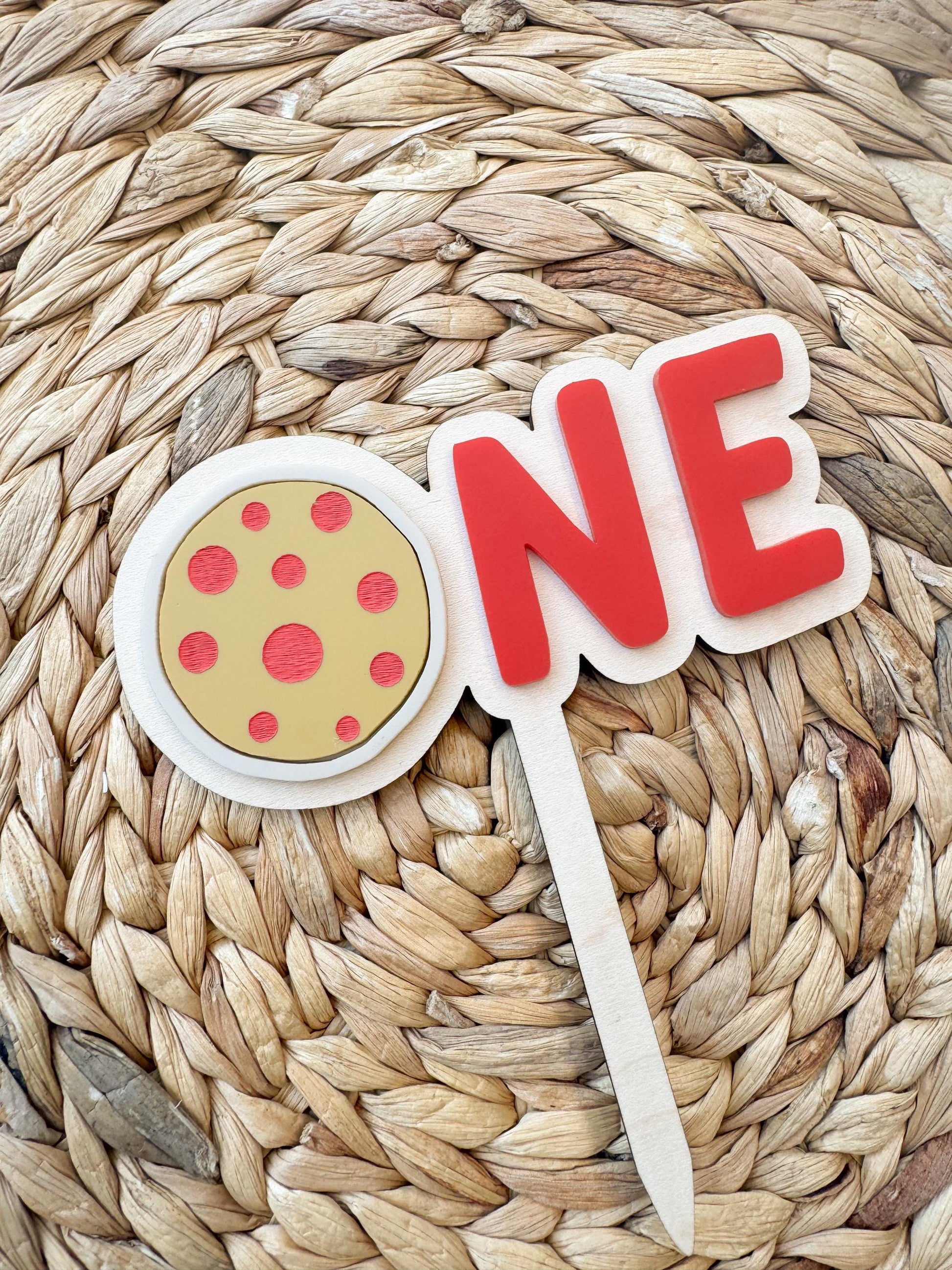Pizza first birthday cake topper showing layered acrylic construction and color options