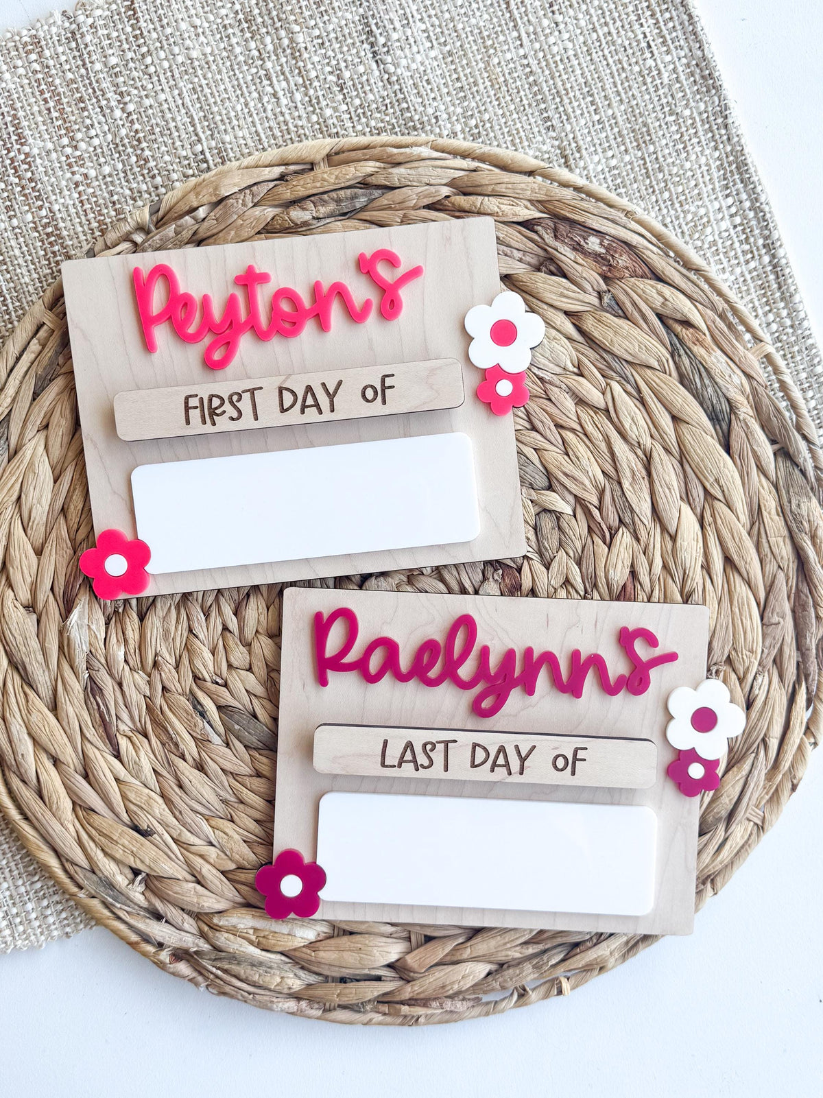Custom wooden back-to-school signs with magnetic name tags and flower accents.