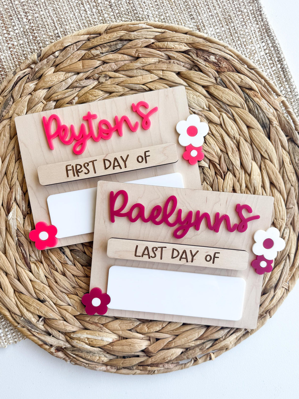 Two school memory boards featuring ‘First Day Of’ and ‘Last Day Of’ labels with colorful acrylic flowers.