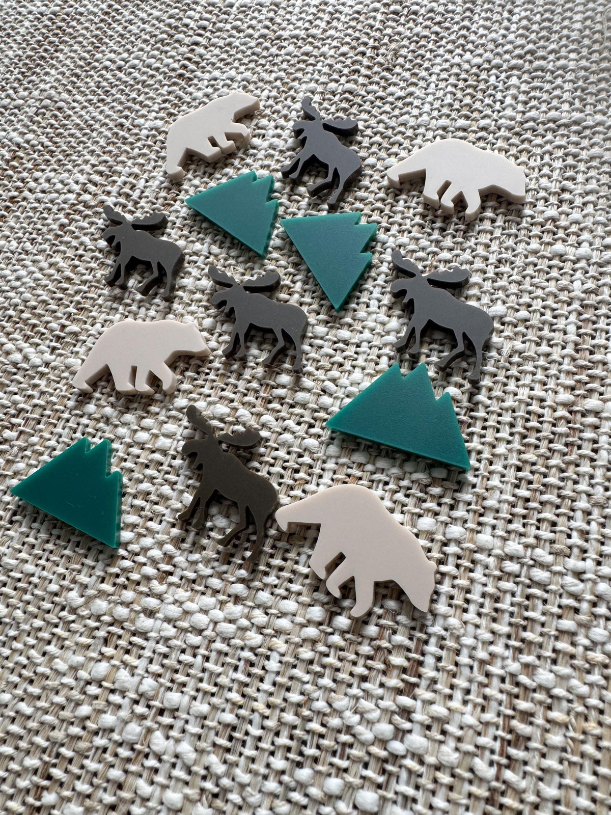 Close-up of 1/8 inch acrylic forest animal reward tokens
