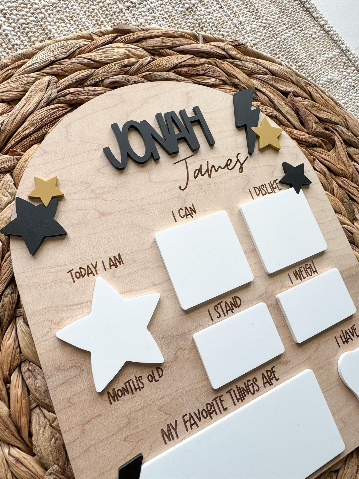Arch monthly stats sign with dry erase sections for age, weight and favorites