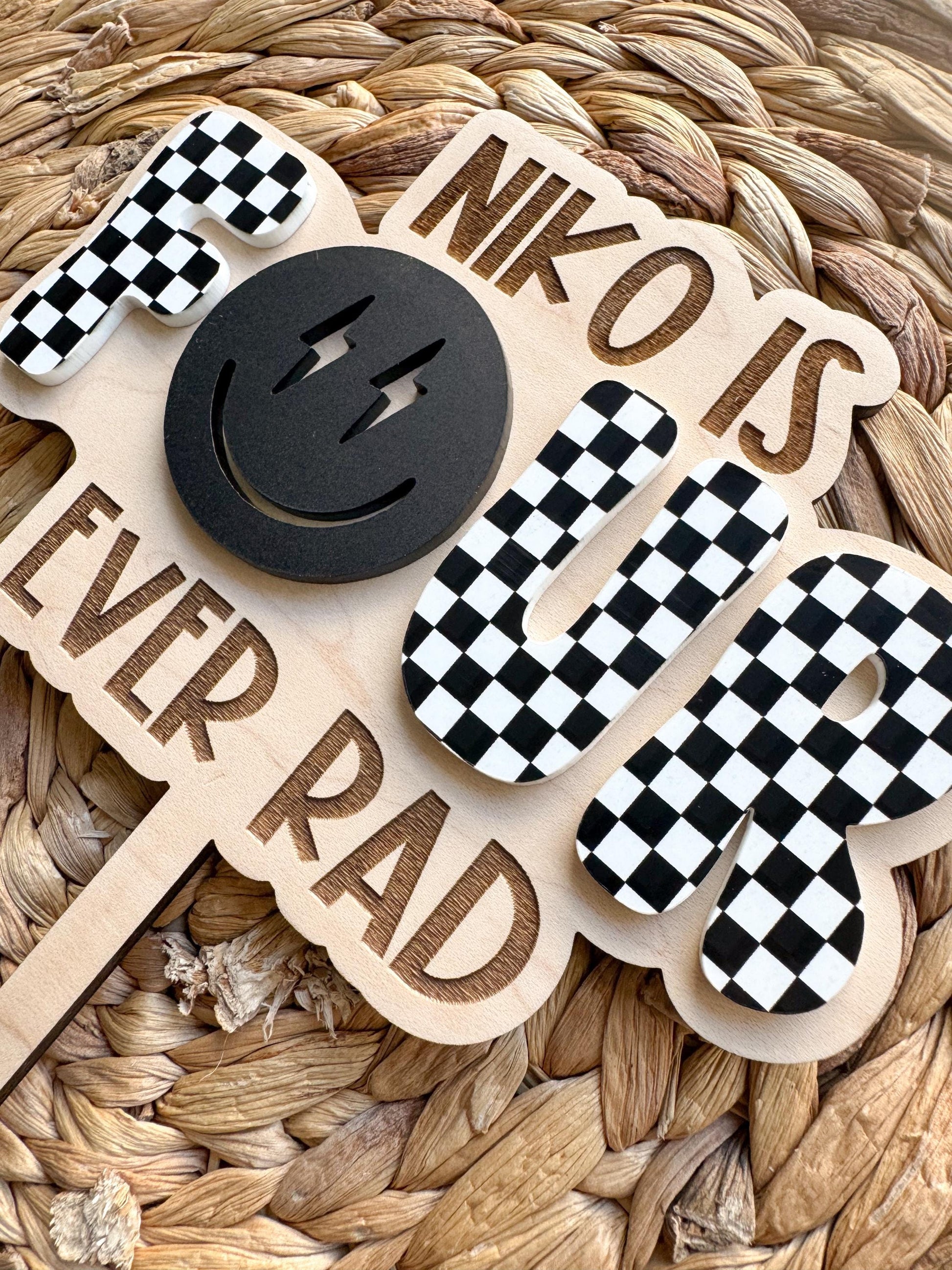 Personalized Four Ever Rad Dude 4th birthday topper showing checkered design and custom name