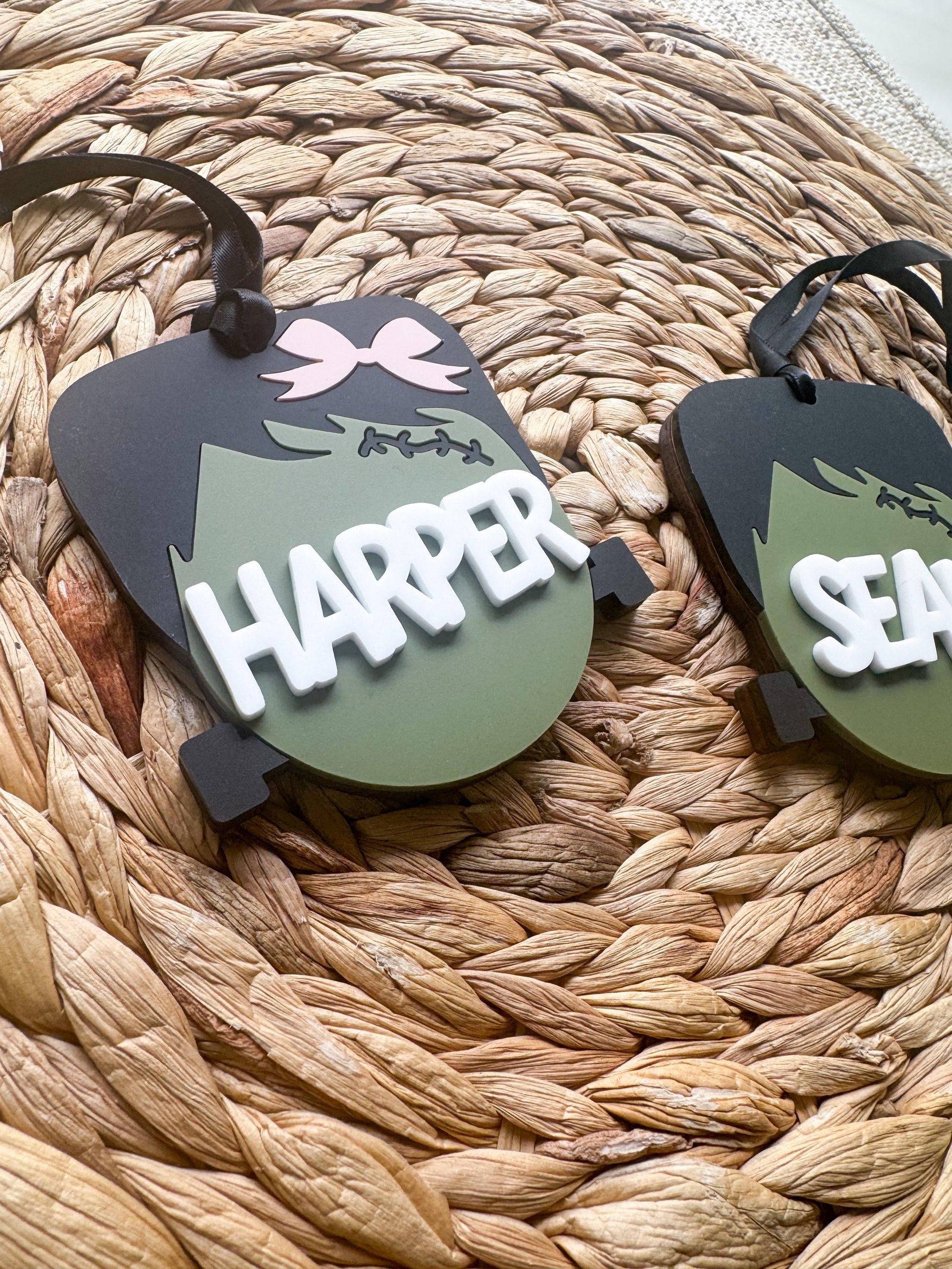 Close-up of personalized 3D acrylic Halloween name tag with custom child's name