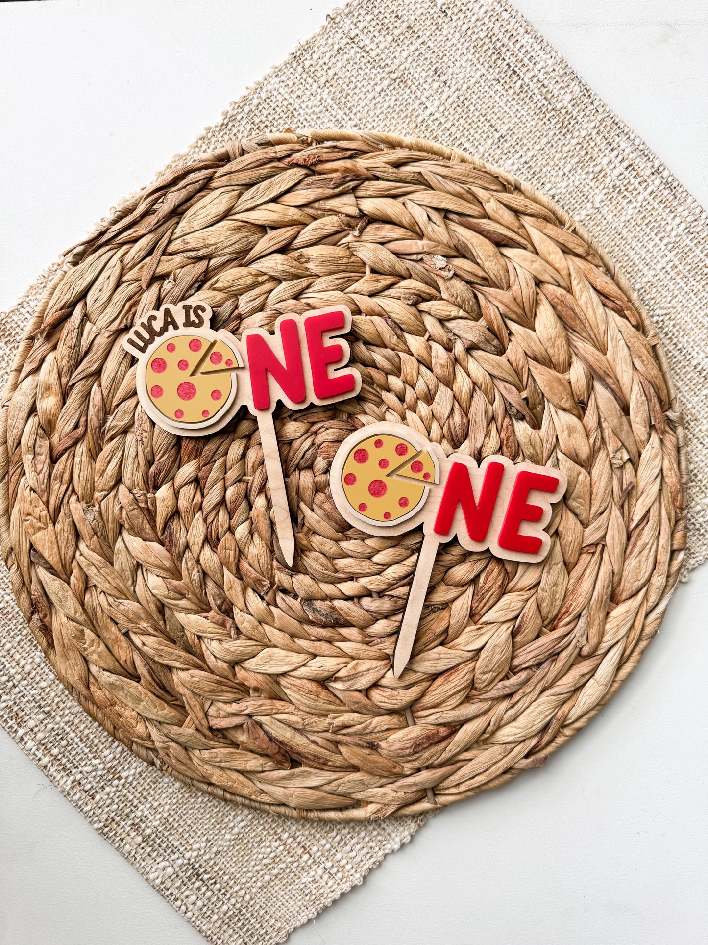 Personalized pizza first birthday topper showing layered wood and acrylic pizza design