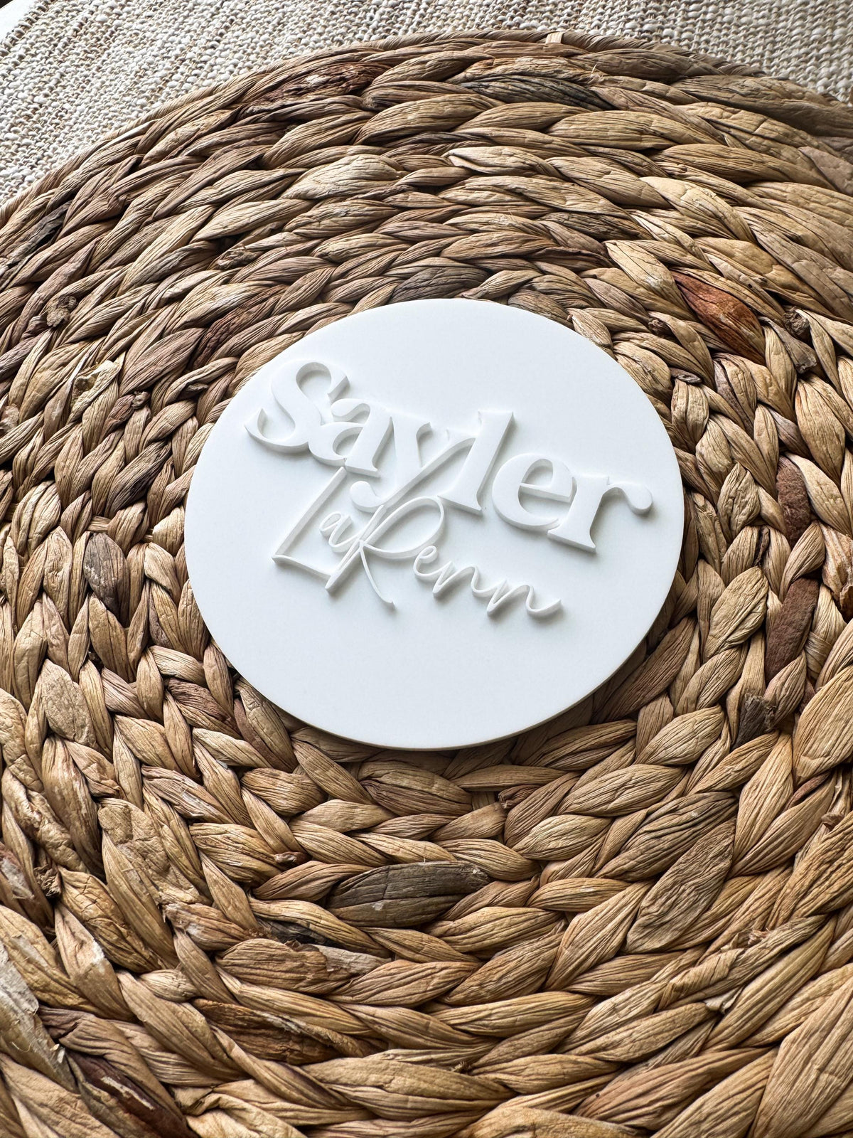 Personalized name round with clean modern fonts for a nursery