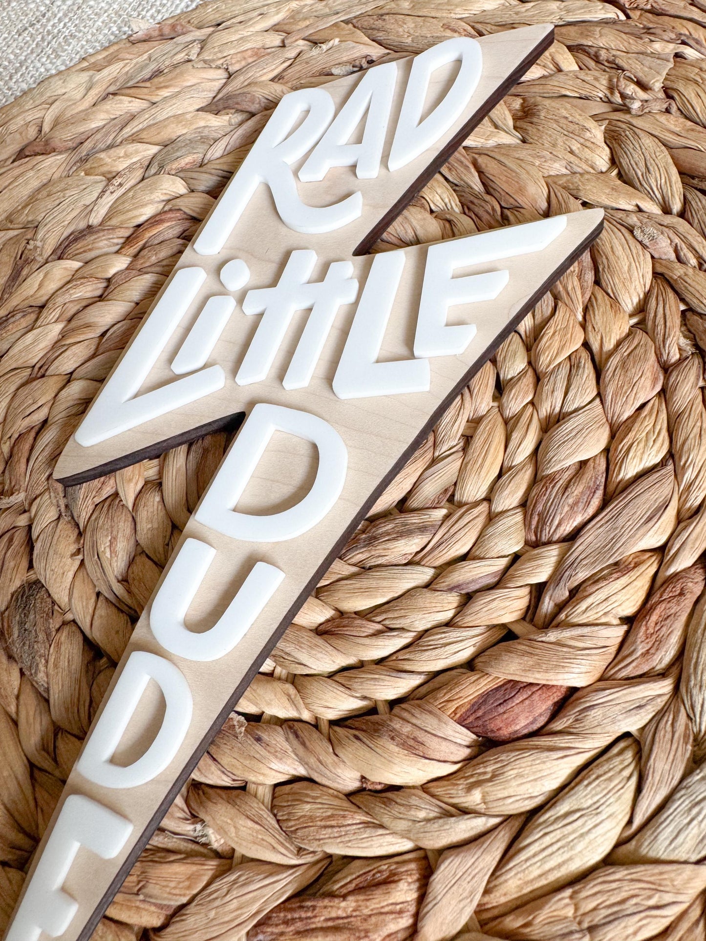 Close-up of Rad Little Dude engraved maple wood wall sign for kids room