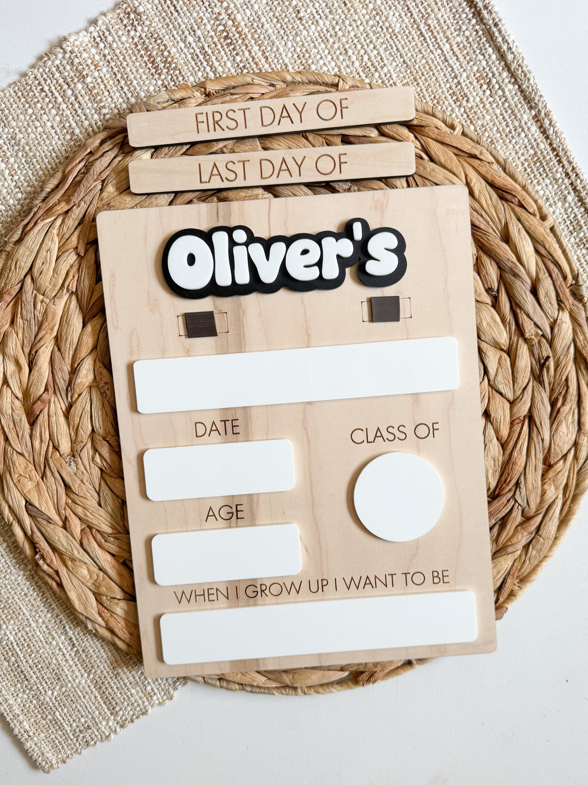 Personalized first day of school board displayed on a white background, showing the customizable dry erase sections, layered acrylic name, and natural wood finish.
