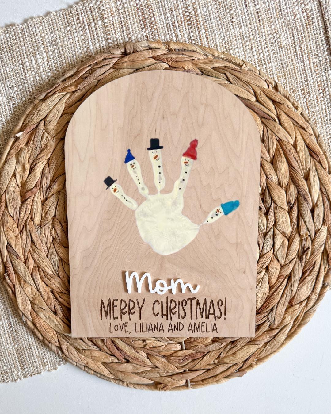 Handprint Christmas keepsake sign with painted handprint design and engraved Merry Christmas on maple