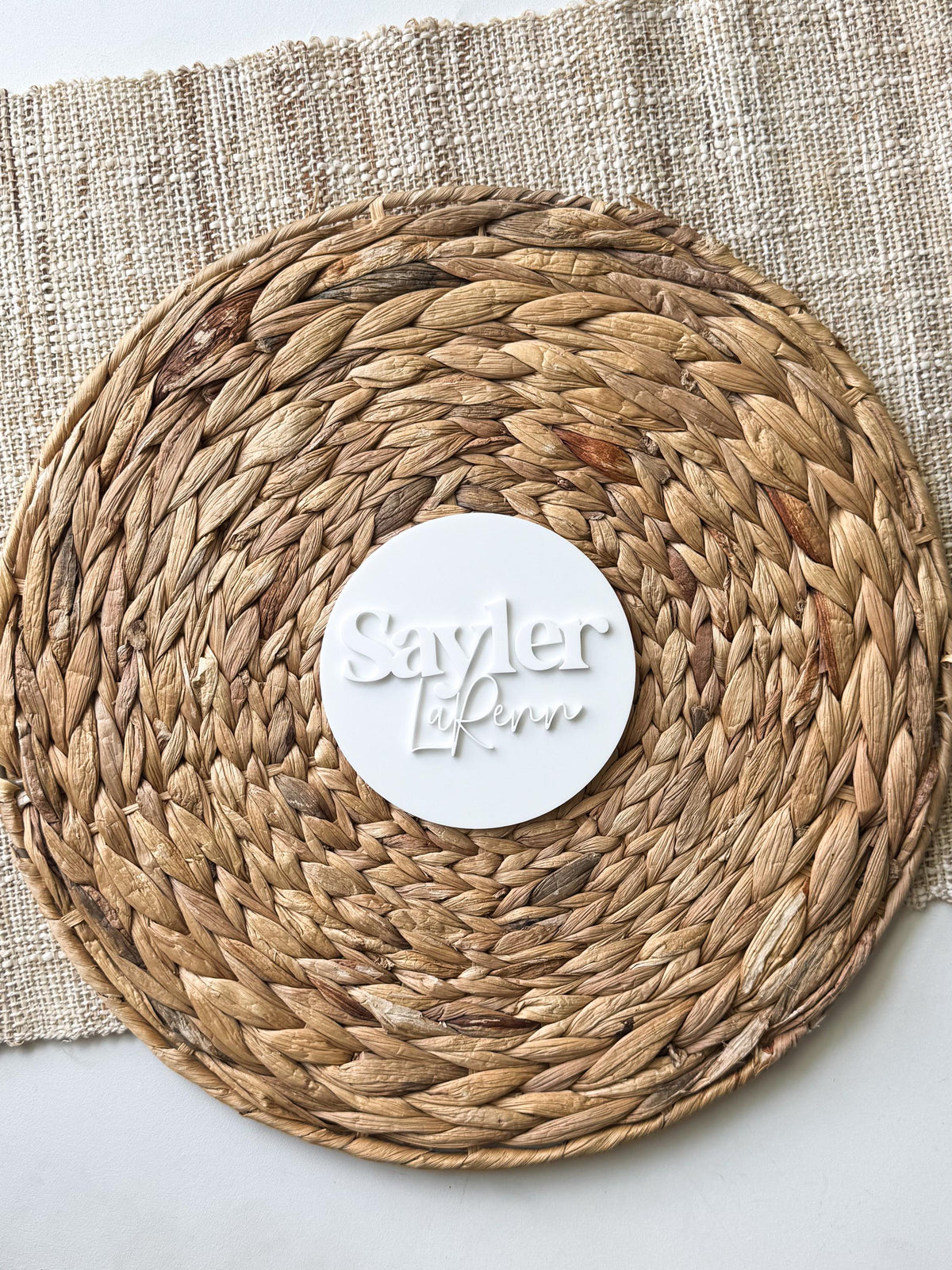 Close-up of the laser cut layered name on a custom baby sign