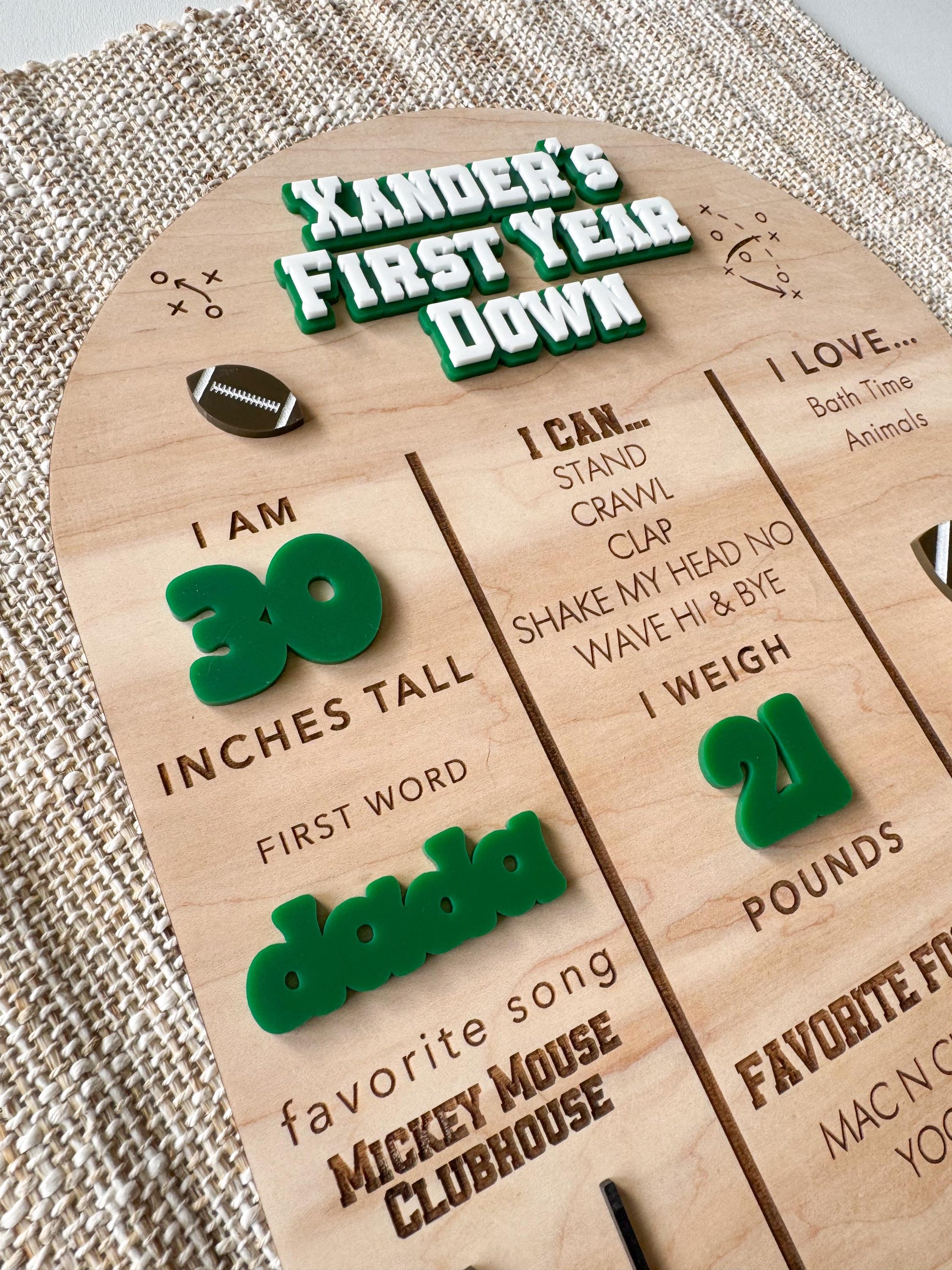 Personalized wooden football first birthday stat board showing baby stats and football design