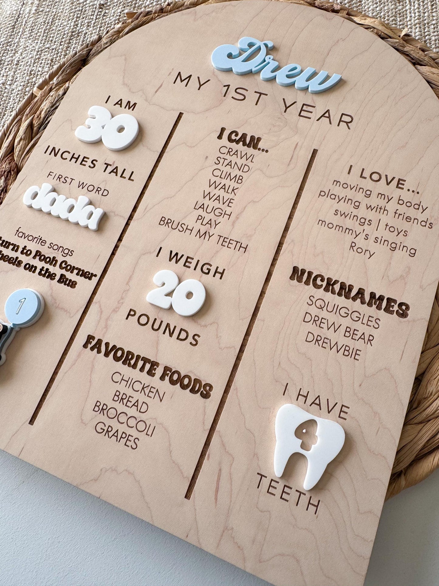Baby first year milestone board with engraved stats and teddy bear themed detail