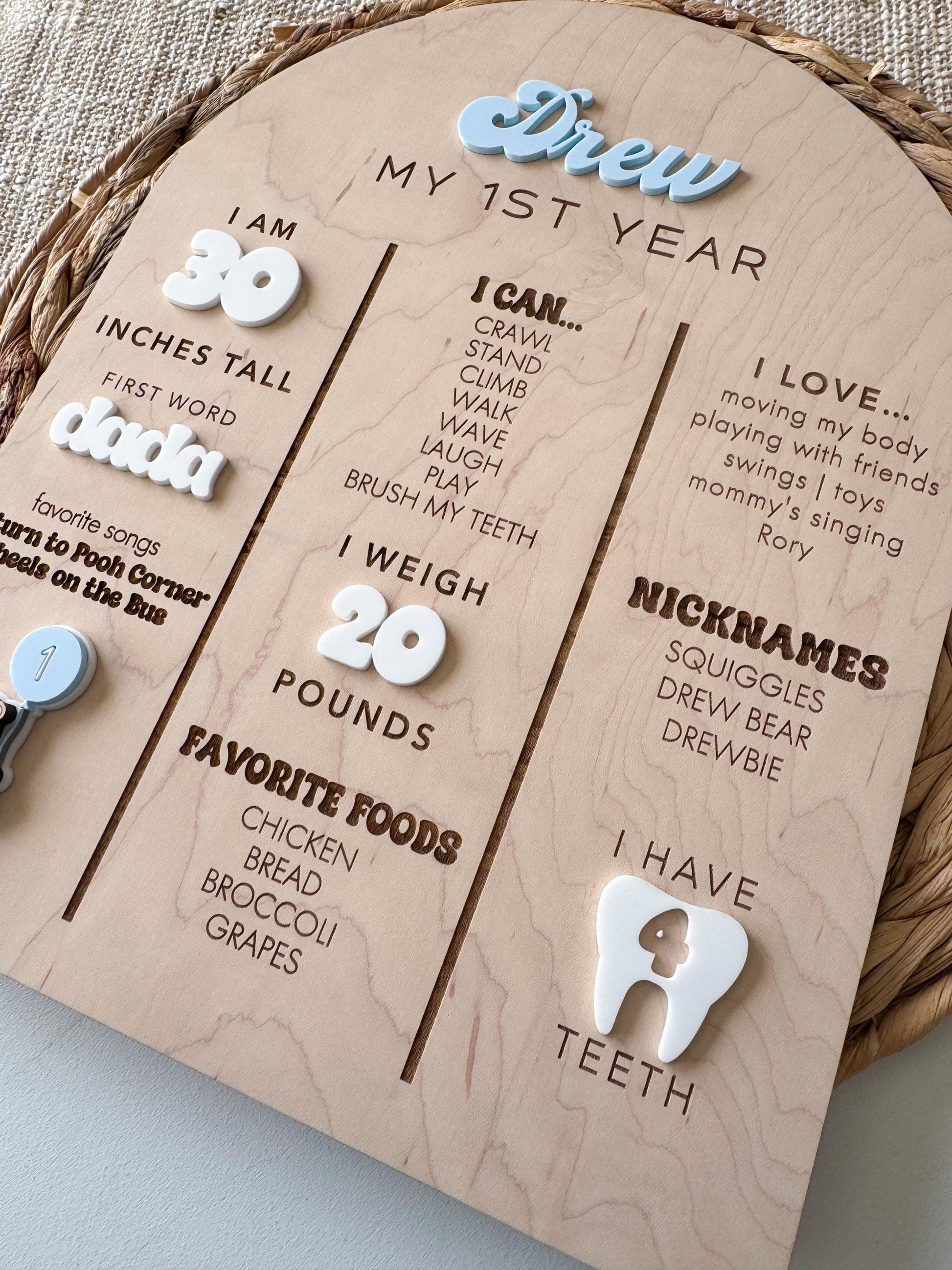 Baby first year milestone board with engraved stats and teddy bear themed detail